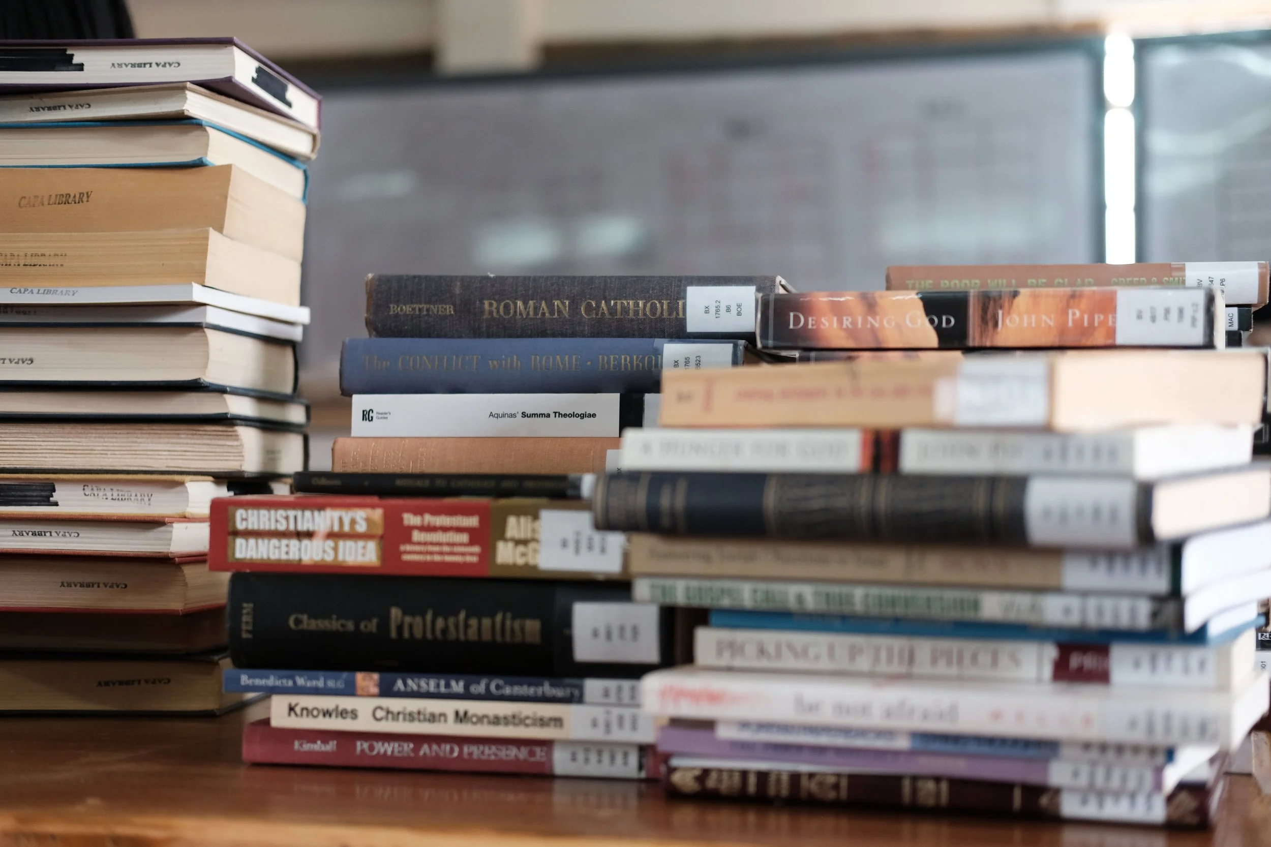 Seminary library books being reorganized by a short-term ministry team from the United States.