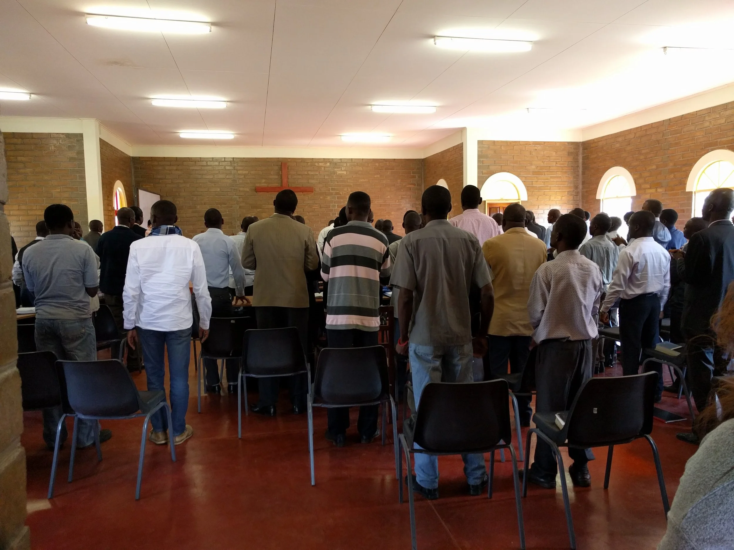 Students stand together to sing during chapel.