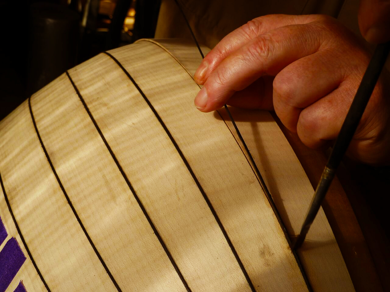 Gluing a black line in between lute ribs_preview.jpeg