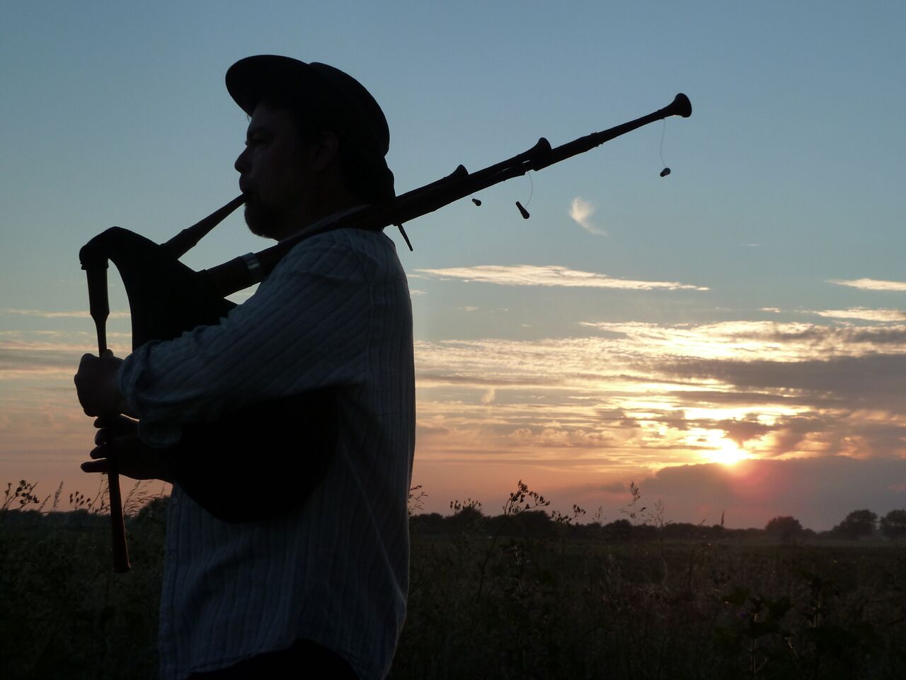 George with bagpipes sunset_preview.jpeg