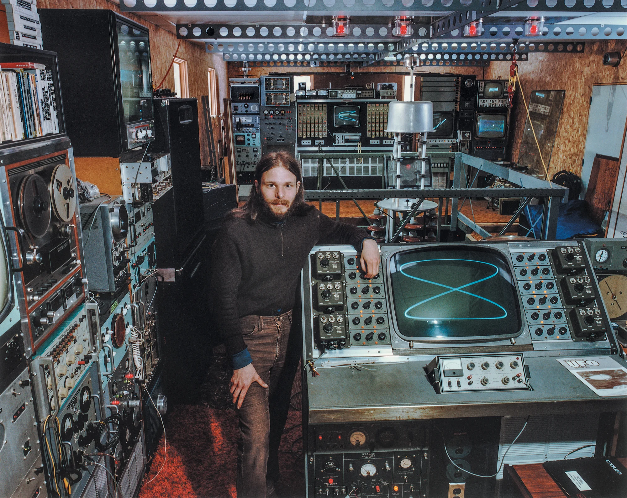 John Shepherd converted his grandparents home into a UFO detection station to house his Project S.T.R.A.T., beaming music and electronic signals into space in hopes of contacting extraterrestrial life. Bellaire, Michigan 1983.