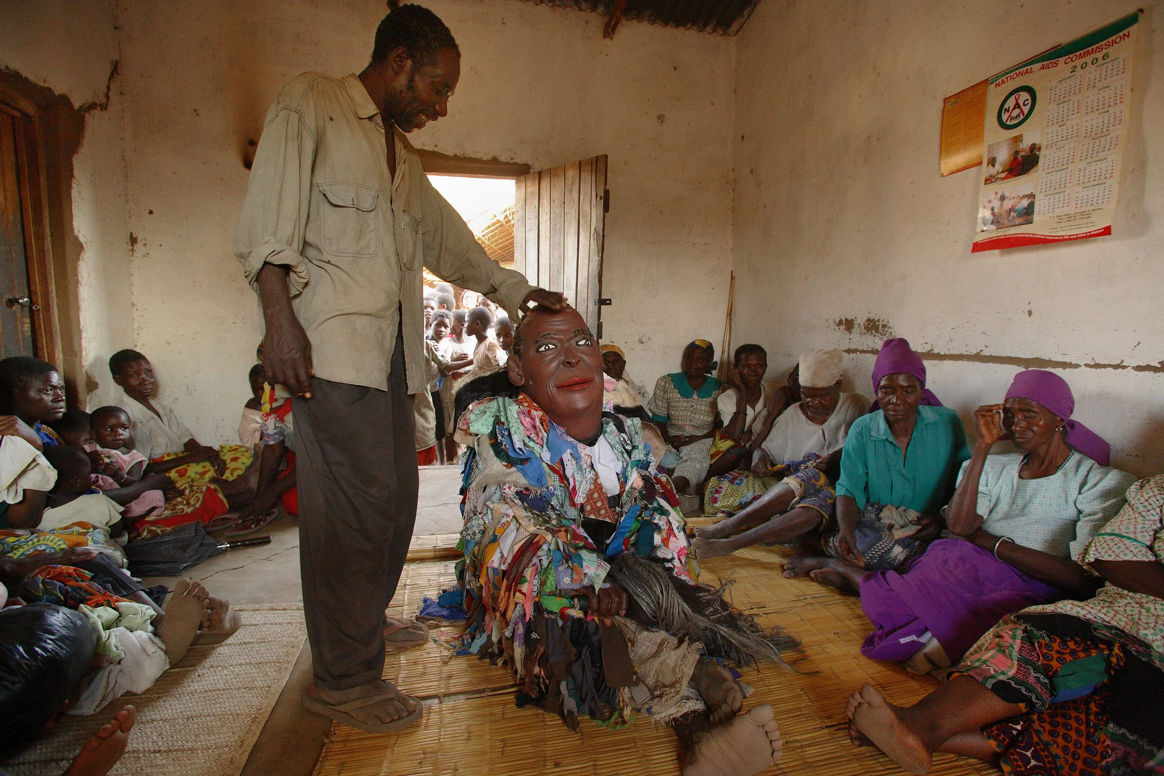 In the village of Chitule, Dedza district, Malawi, a masked spirit figure of the departed Chief Chitule returns to the home to signify to his wife and relatives that despite his death he is now in transition to the spirit World of the Dead.