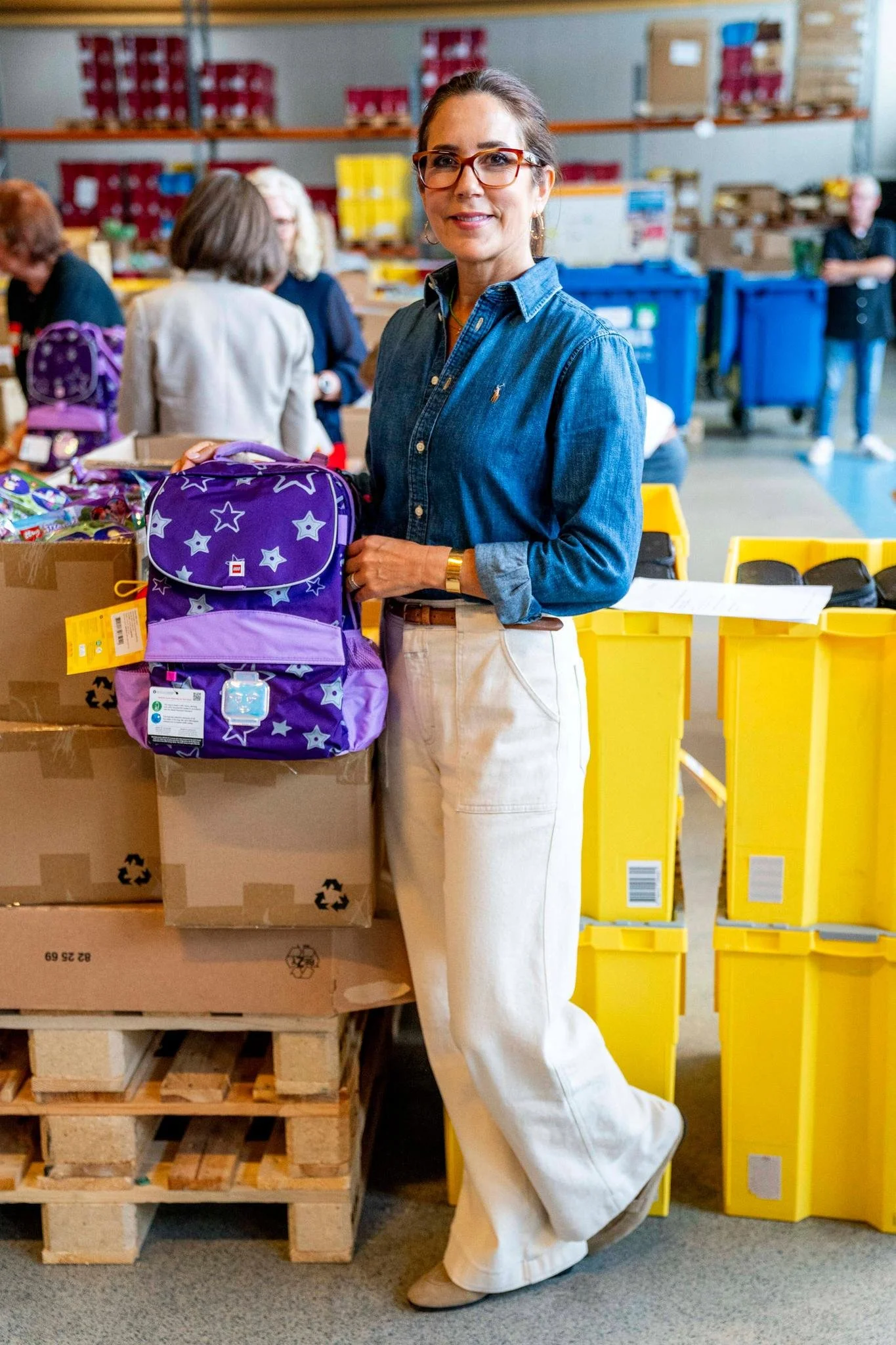 Crown Princess Mary Packs Backpacks for Children in Crisis Centres at LEGO Charity