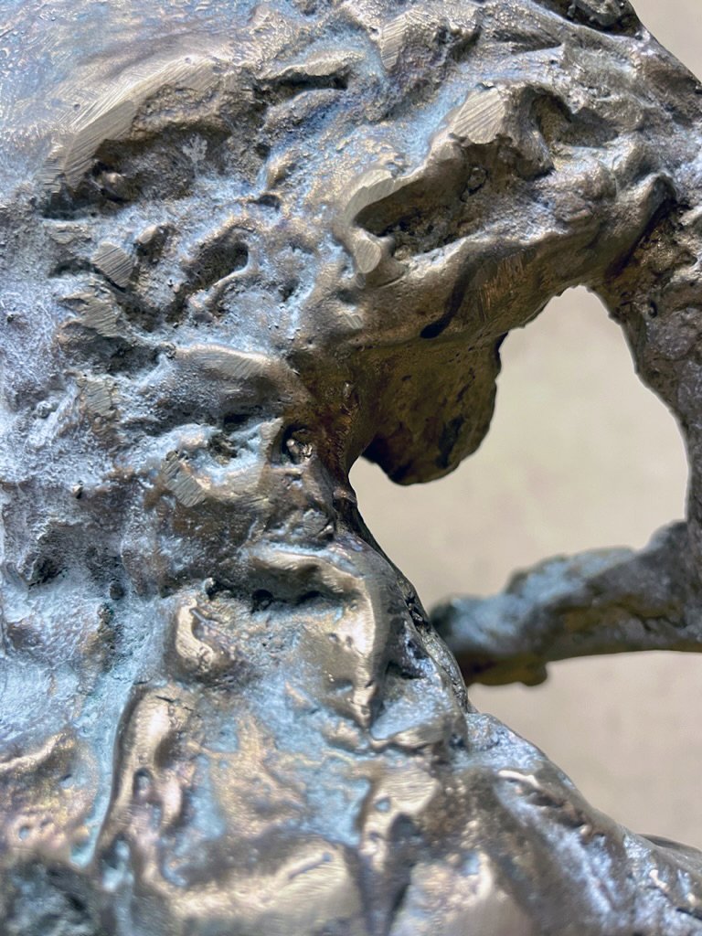 Detail of Puritan in bronze with dioxide white patina