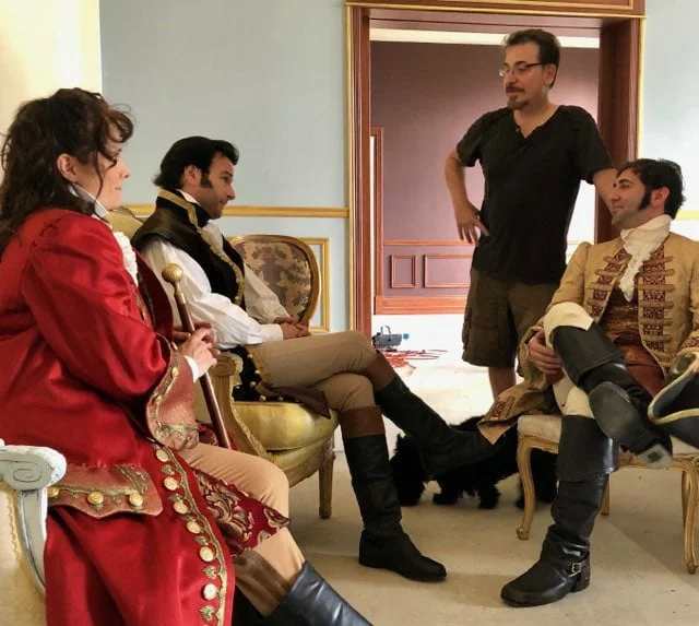 On location, during a pre-shoot preparation for an “In Character” group headshot session set in 18th Century France.