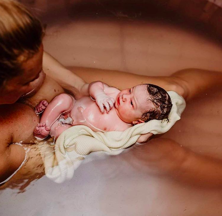 colourful water birth float baby.png