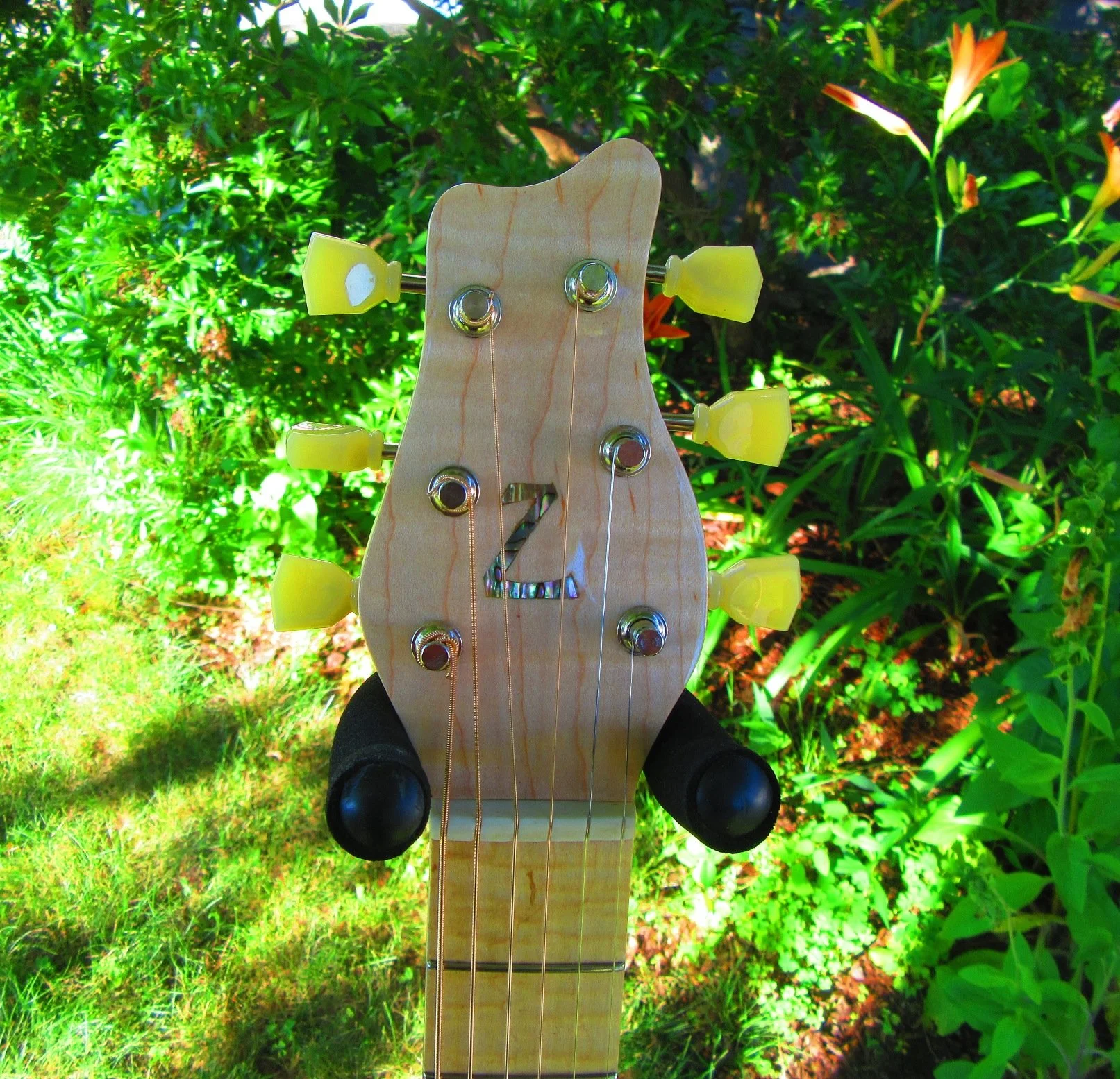 Curly Maple peghead overlay with Abalone "Z"
