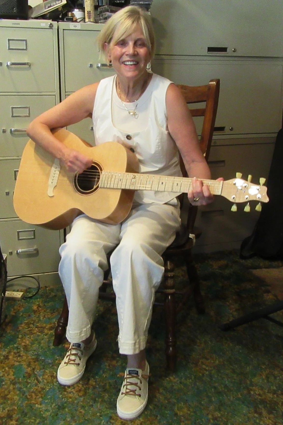 Michelle playing her guitar