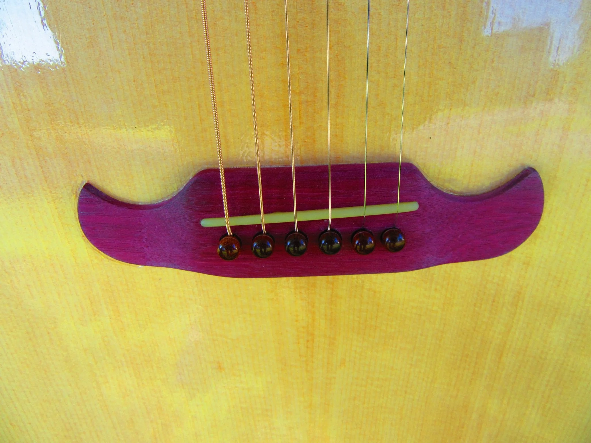 Purpleheart bridge with Snakewood bridge pins