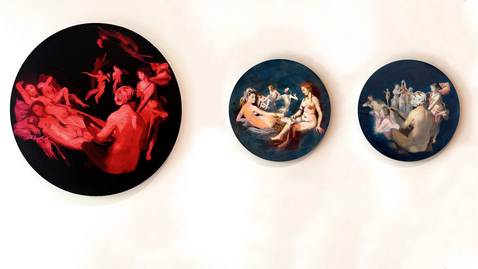 A large round painting with red figures from classical paintings, and two pastel drawings with figures