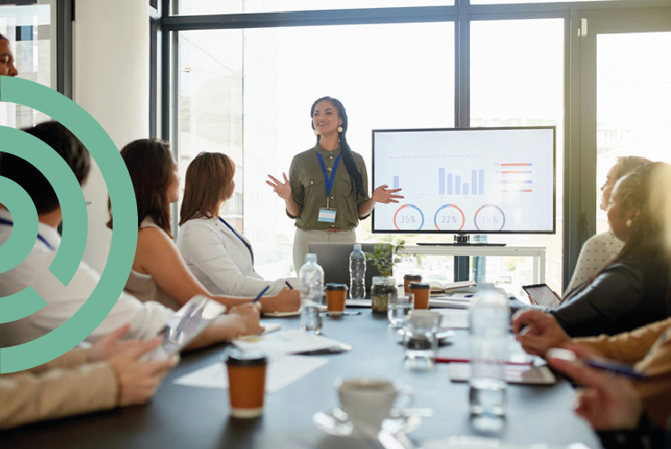 A woman giving a presentation in an office
