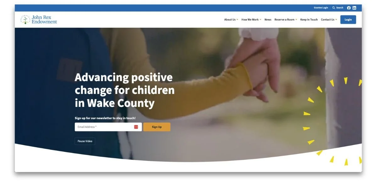 John Rex Endowment website hero section showing an adult and child holding hands with messaging about advancing positive change for children in Wake County.