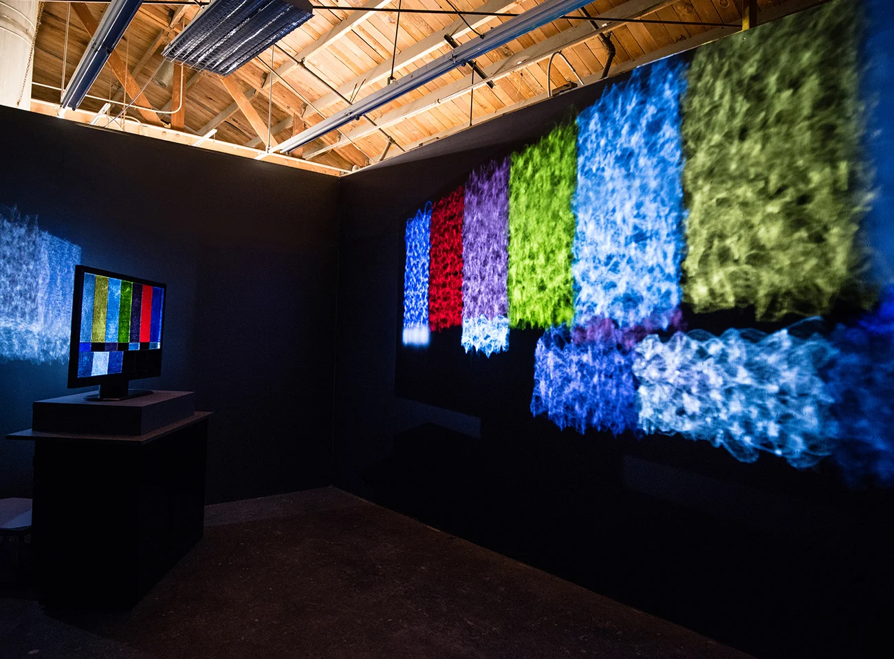   Channeling  (installation view), stained glass, wood, paint, video projection, 2016 (photo: Keith Carlsen) 