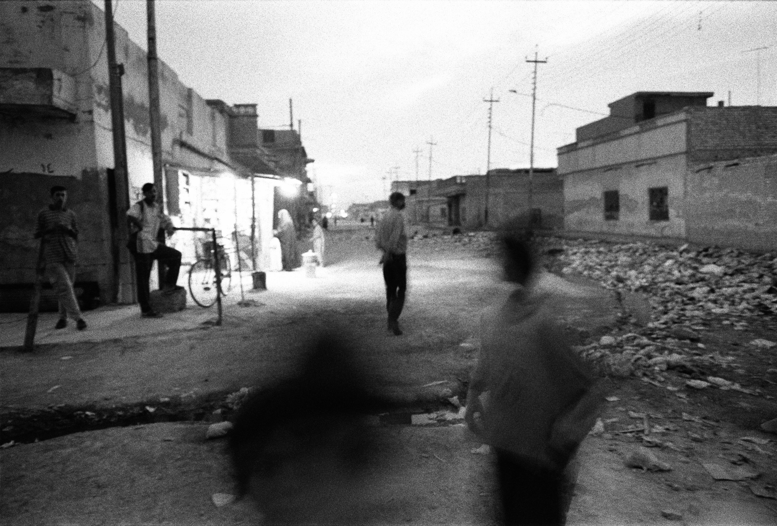  In the Jumhuriyah neighborhood of Basra, Iraq, the streets are strewn with garbage. 