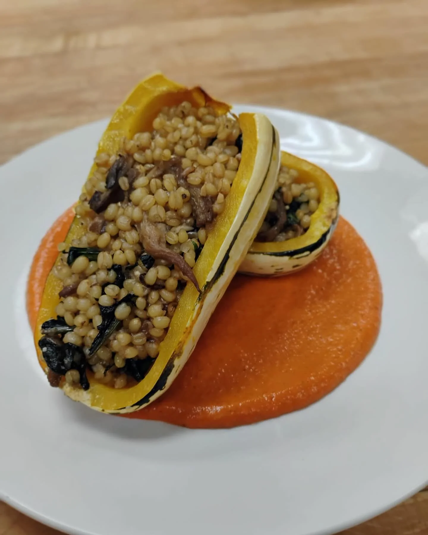 This months pasta club featured a stuffed delicata squash with @haydenflourmills White Sonoran wheat berries, @rogue_rhino_gardens mushrooms, dandelion greens, and a romesco sauce. Make sure to join by end of month to get in on next months pasta dinn