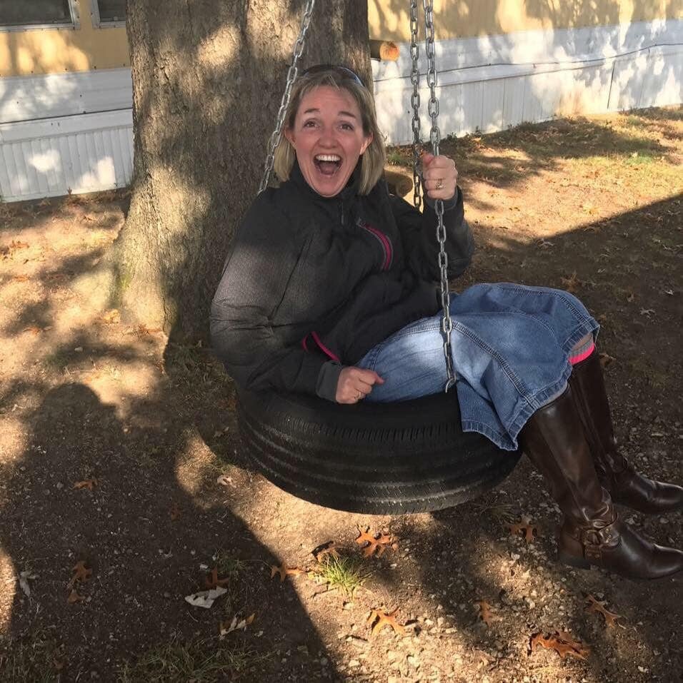 amy in a tire swing.jpg