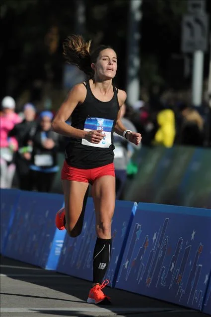 Coming into the finish in Houston, where the time on the clock would be a 6-minute PR but 13 seconds shy of an Olympic Trials Qualifier time.