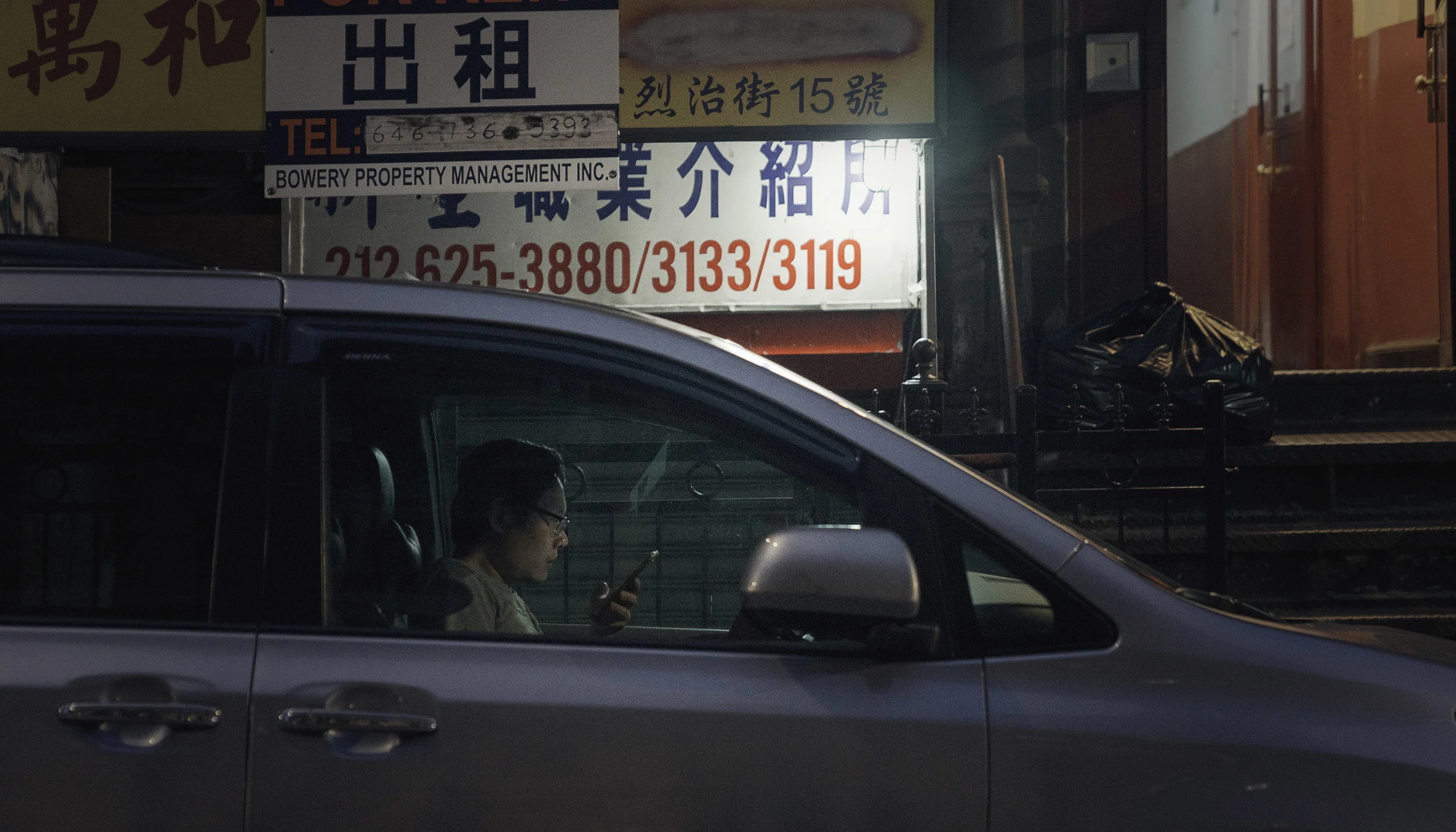 man in phone in car for website.jpg