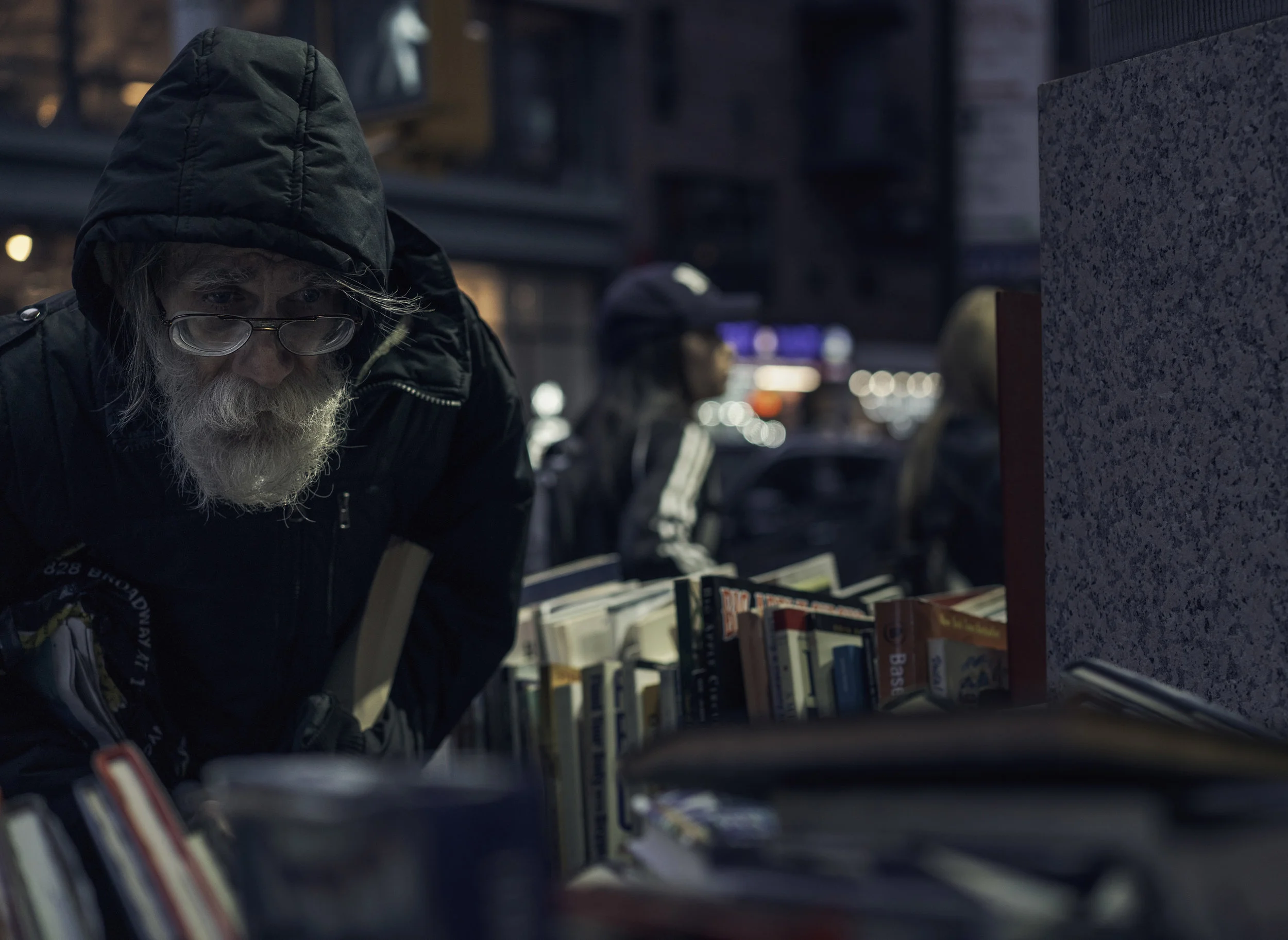 man looking at books for website.jpg