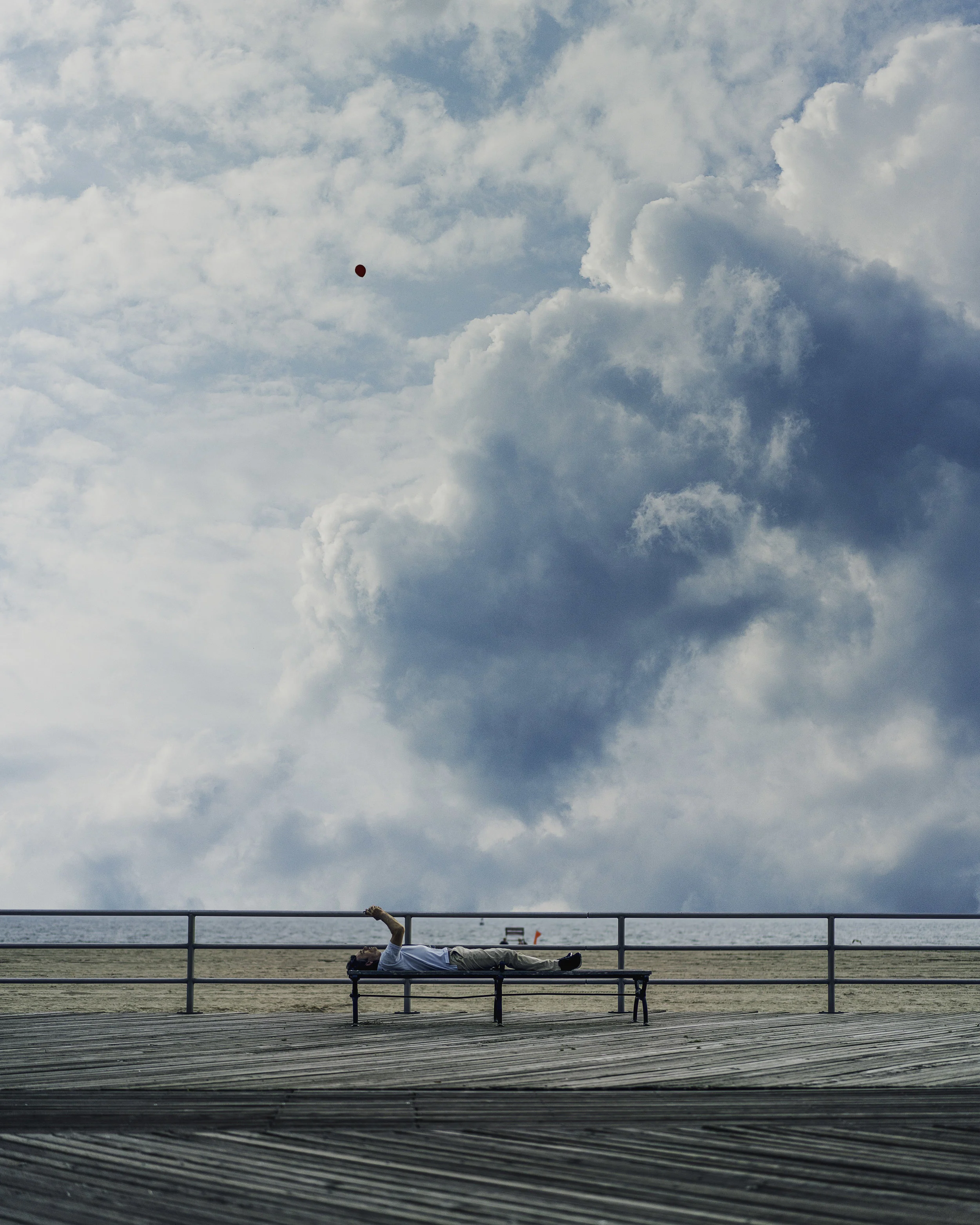 Man on phone with baloon for website.jpg