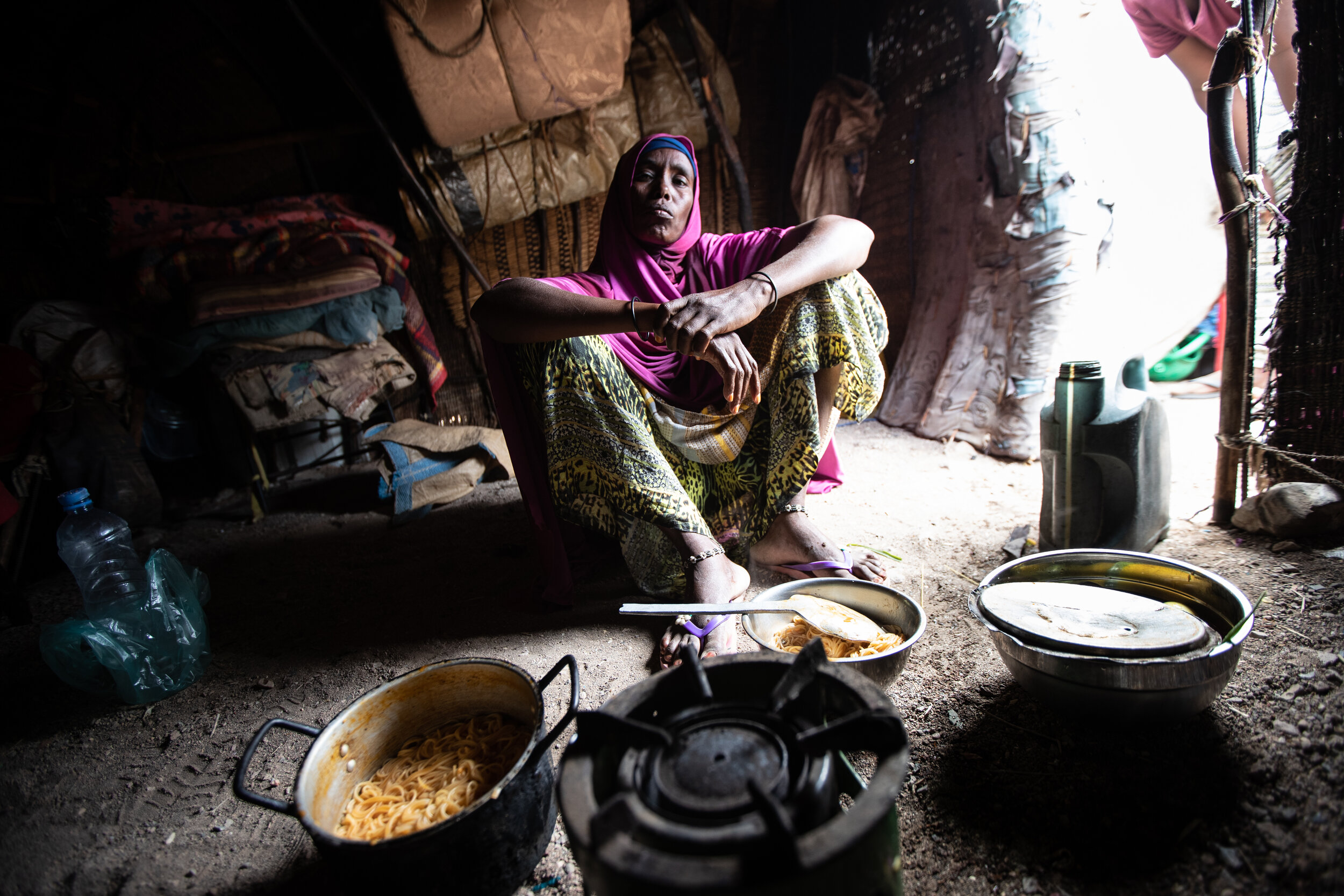  Moumina Idris Wabri preparing lunch for her family. Ombokta, Djibouti, 2019 
