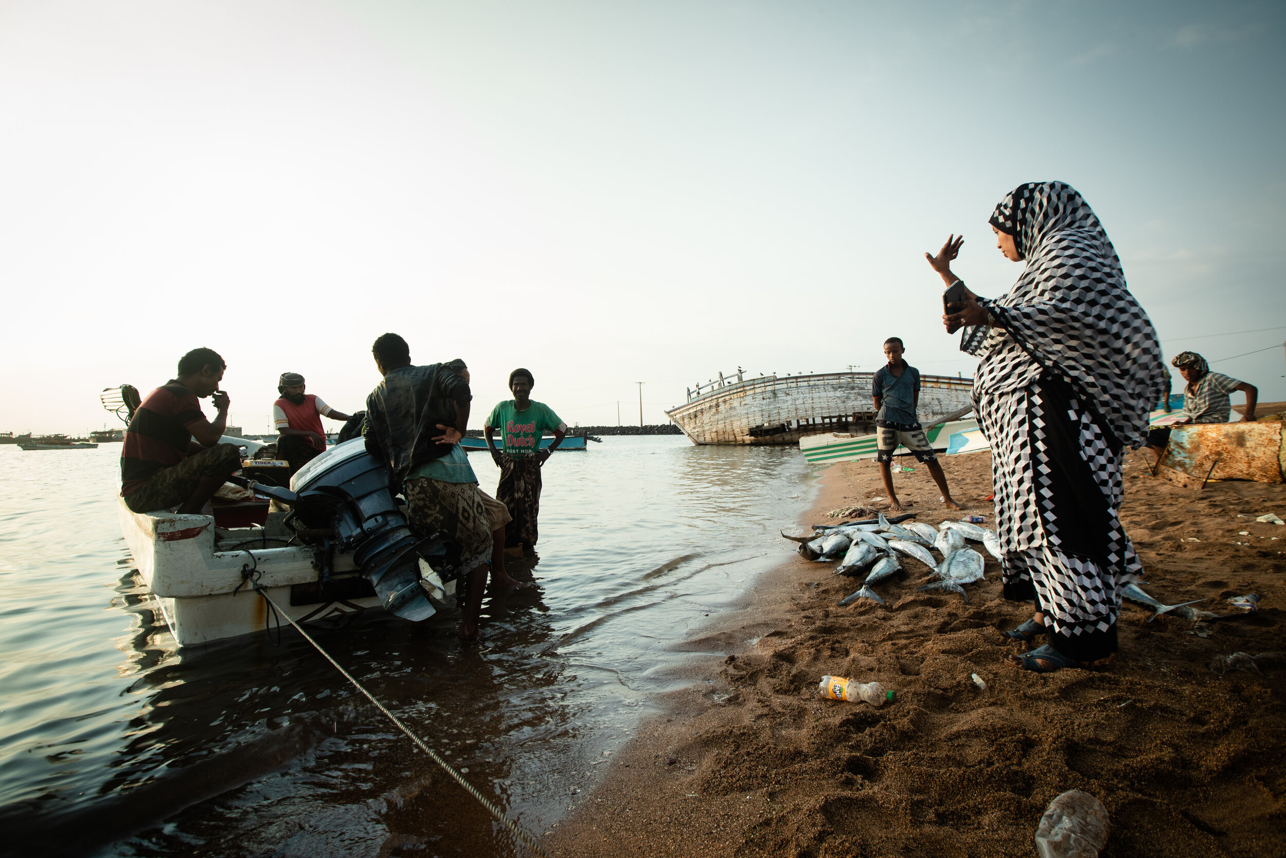  in Obock, I met Aisha, the grand daughter of the grand Darwish who, back in the 80s, was the first fisherman to bring fishing to Obock. everyday Aisha waits on the shore for the fishermen to return with their catch. she monitors them while they weig