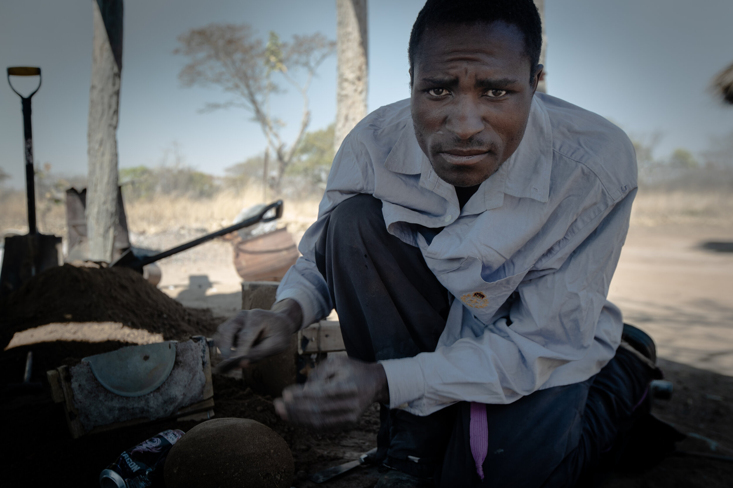 Innocent while molding a three legged pot. Chisungo, Zimbabwe, 2019 