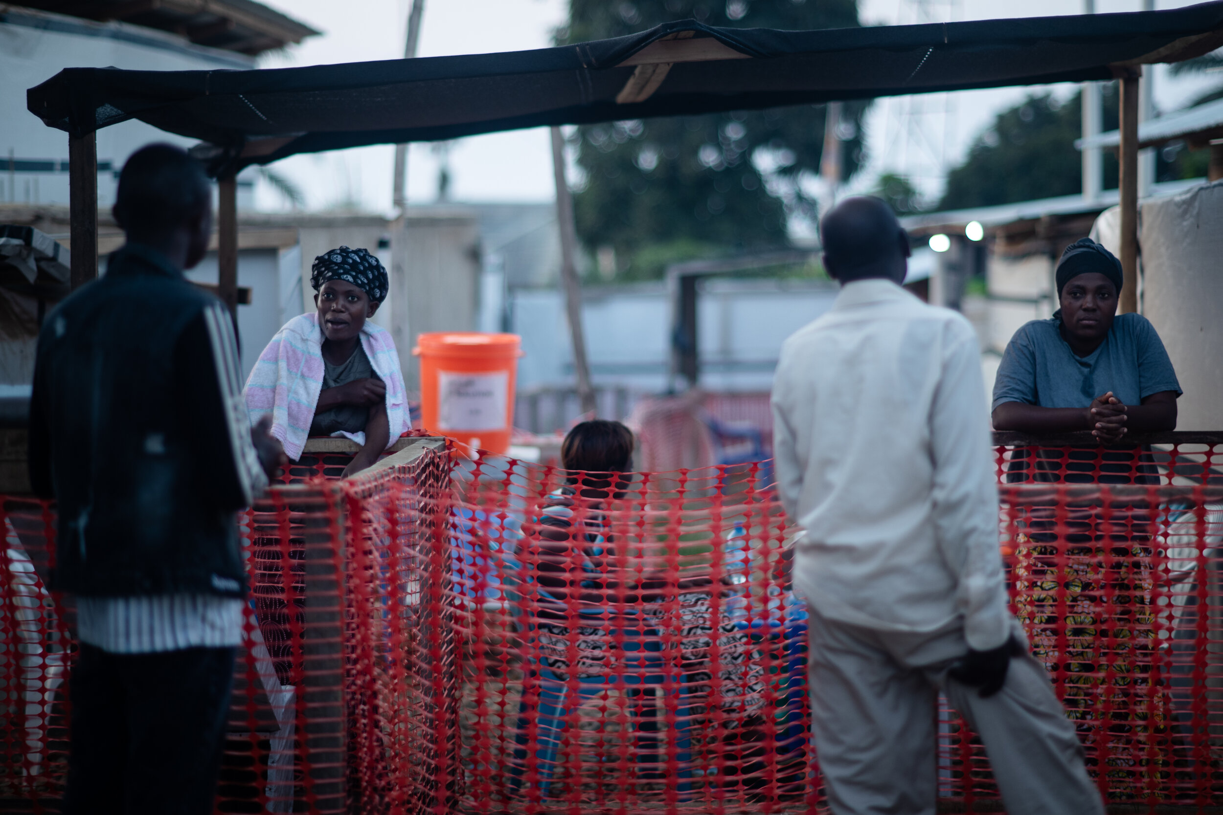  family members visit the recovering patients while standing at a safe distance, at Beni Ebola treatment center, The Democratic Republic of Congo, August 2019 
