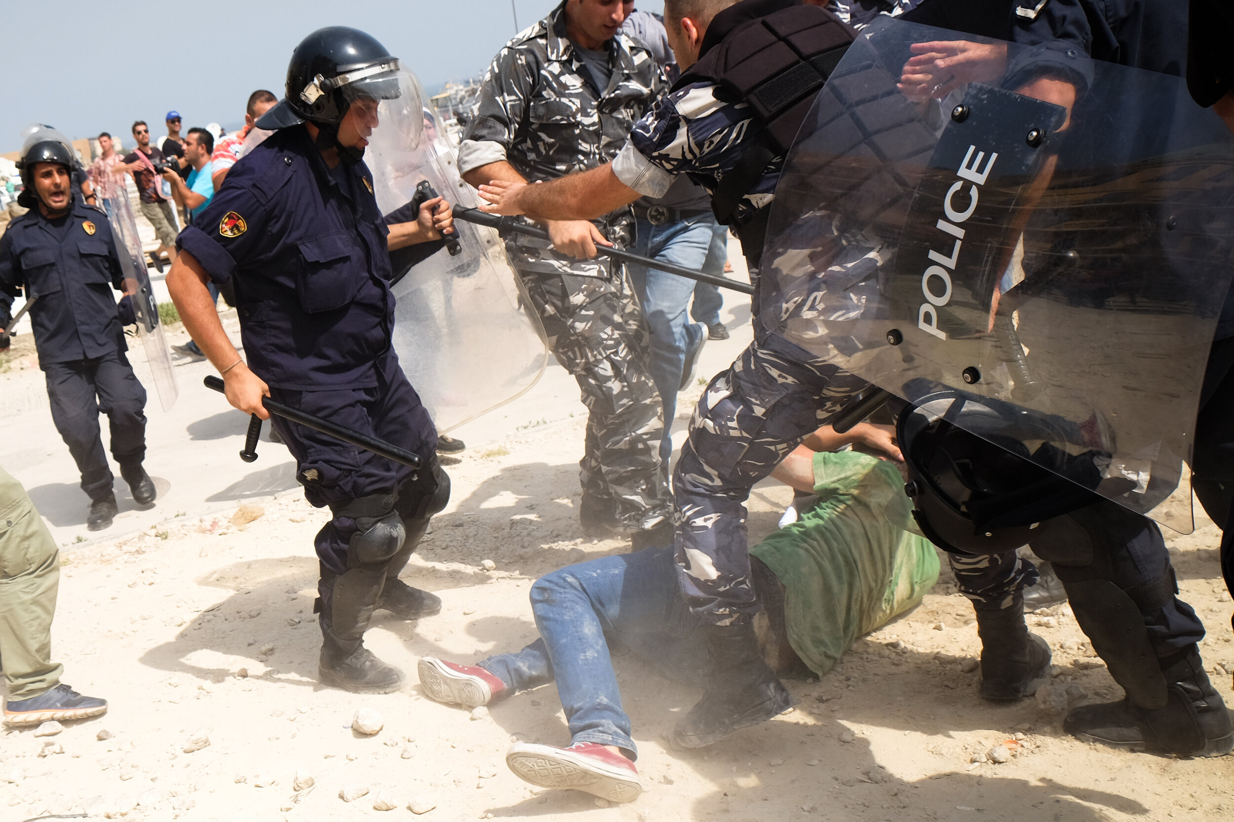  the five police men beat up the peaceful protestor before dragging him and arresting him. during the protests in response to the waste crisis in Lebanon. Beirut 2015 