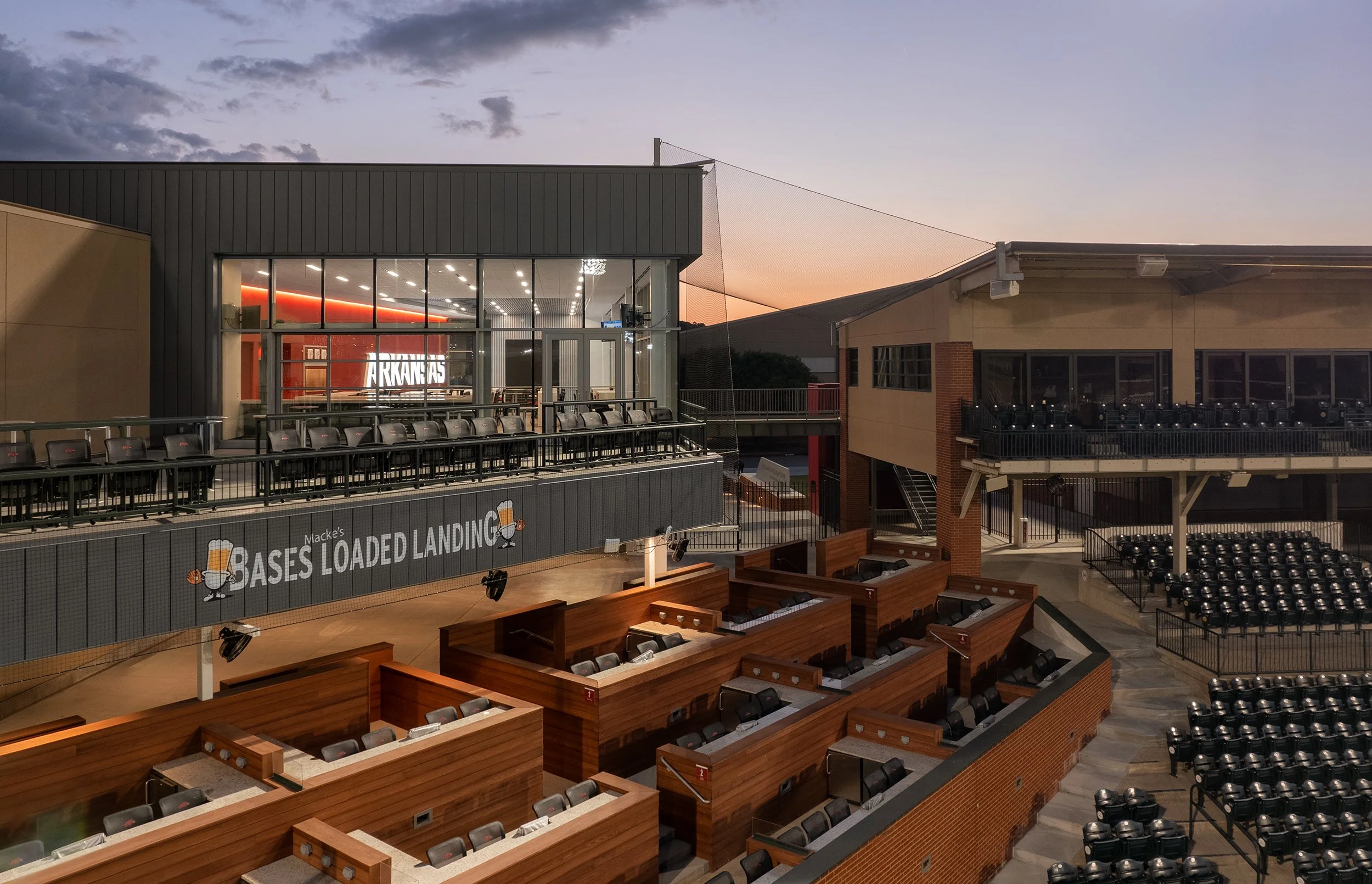 University of Arkansas Baseball Development Center - Dusk Aerial to Loge and Upper Deck to Lobby.jpg