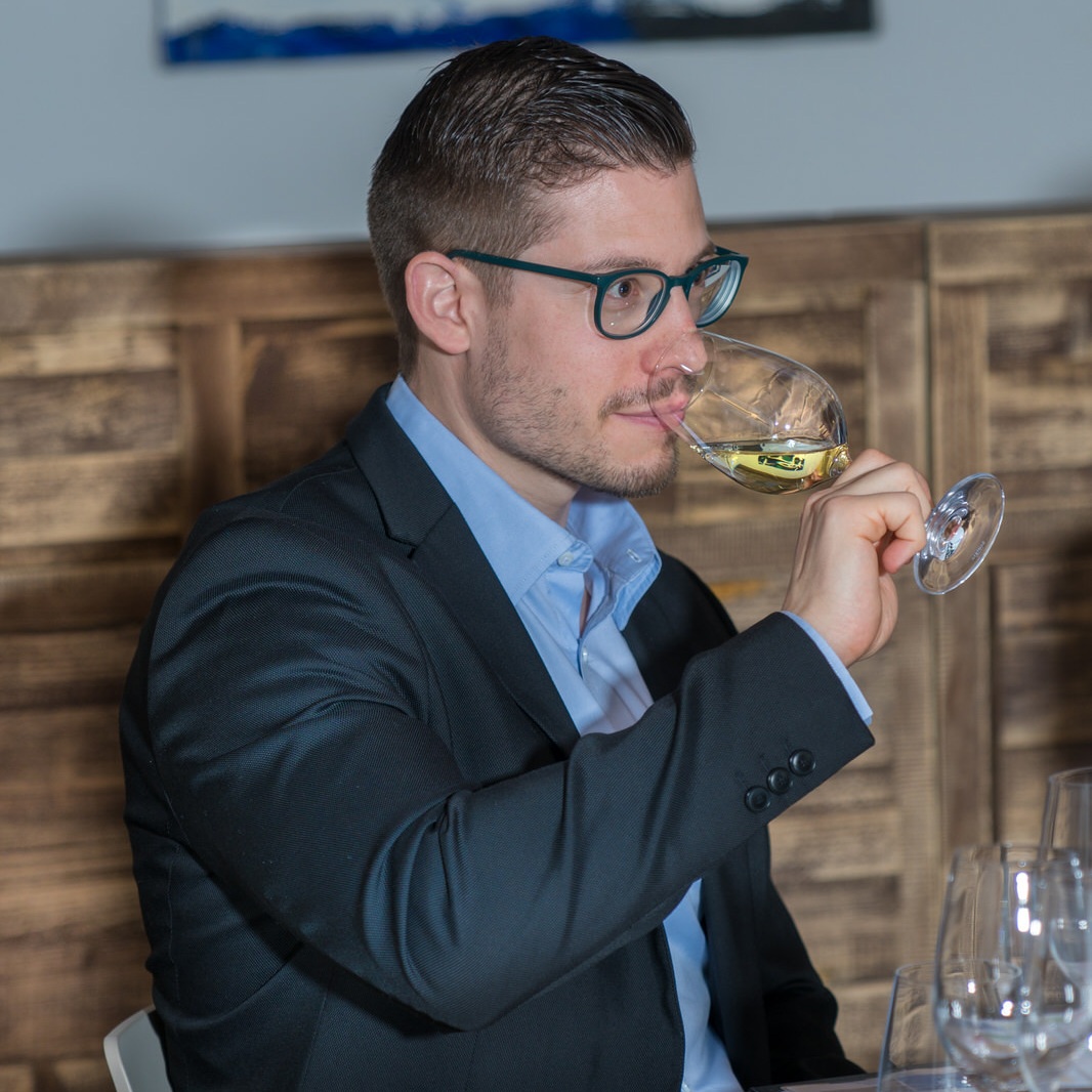 client+enjoying+Austrian+wine+during+an+exclusive+wine+experience+in+private+wine+tasting+in+private+wine+cellar.jpg