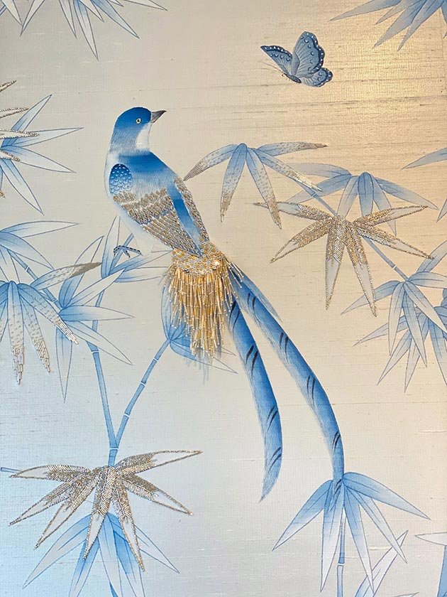  Designer Chinoiserie wallpaper with a hand-painted blue bird on a bamboo branch watching a flying butterfly, a serene choice for luxury interiors. 