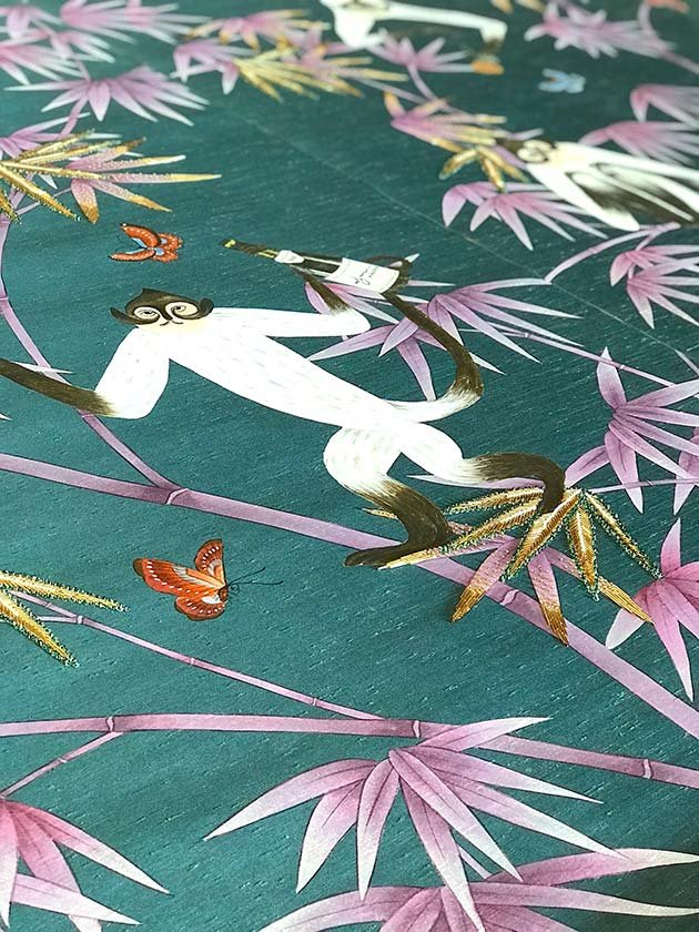  Hand-painted wallpaper with a monkey navigating a bamboo branch towards a butterfly with a margarita, a luxury piece for bespoke interior designs. 