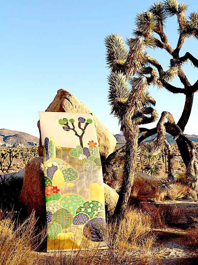  Vibrant and Realistic Joshua Tree Desert wallpaper piece sitting next to a Cactus and Rock in a Warm Desert Landscape. 