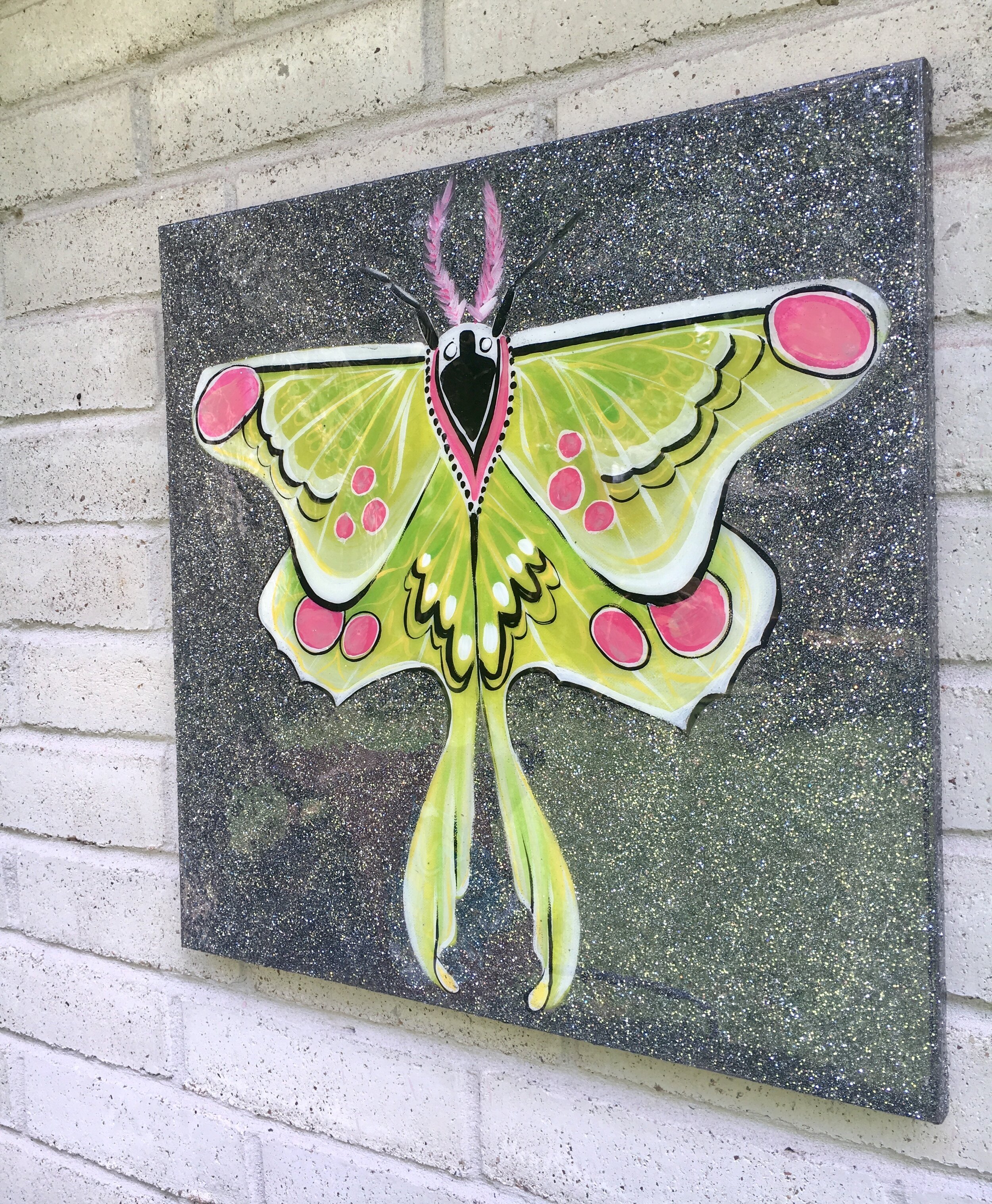 Green and pink moth