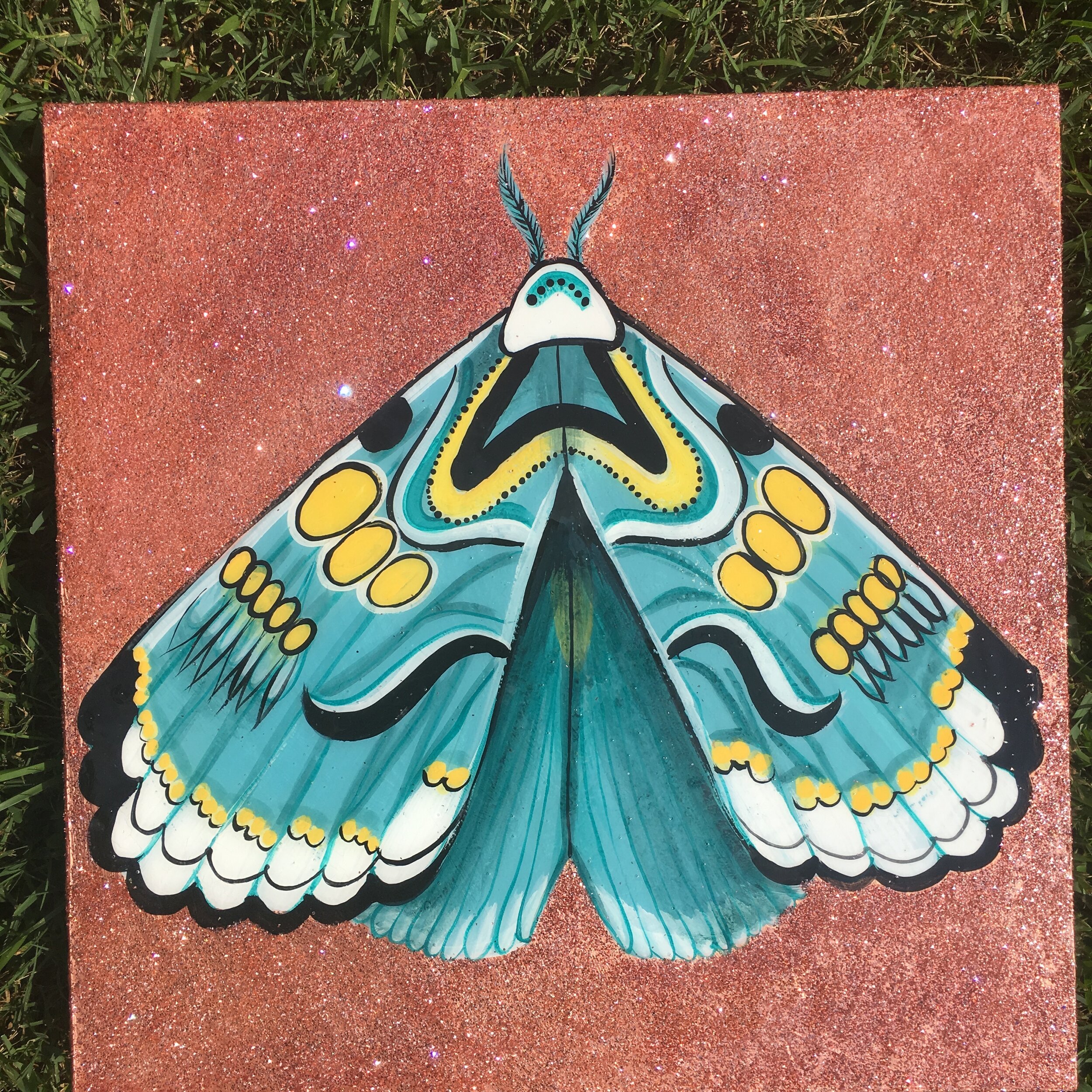 Blue and rose gold moth