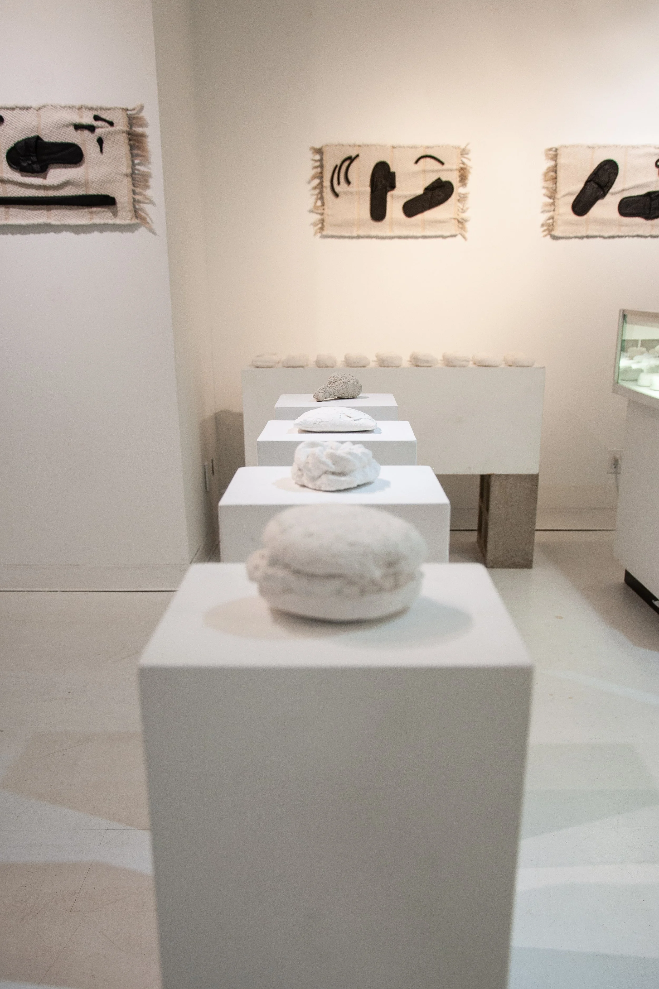   Slightly Nutty, Sweet, and Peppery   2025  Cotton, linen, polymer gypsum, black pigment 26” x 14” x 1” (smallest), 26” x 14” x 2” (largest) 