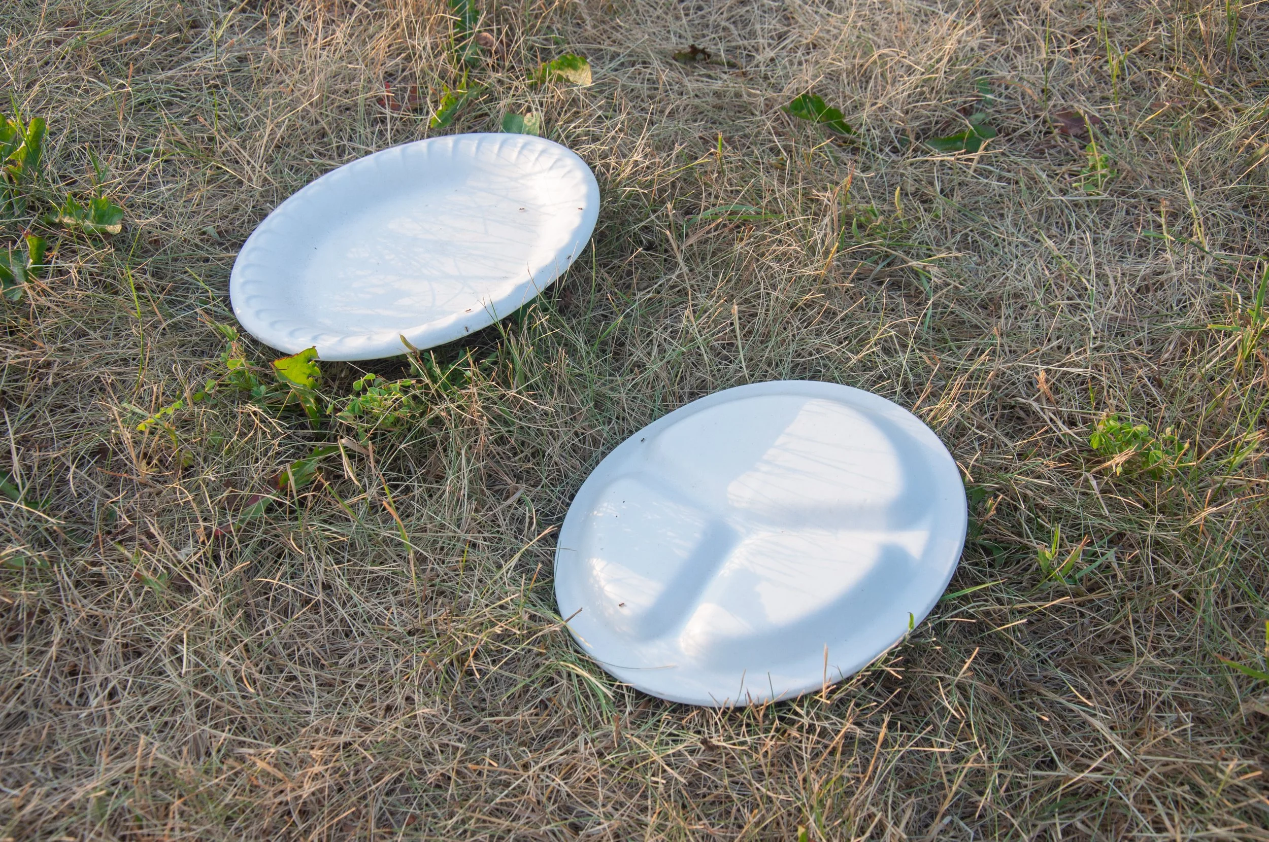 "Exports" (2021). Stoneware clay, ceramic glaze. 8” x 8” x 1”

