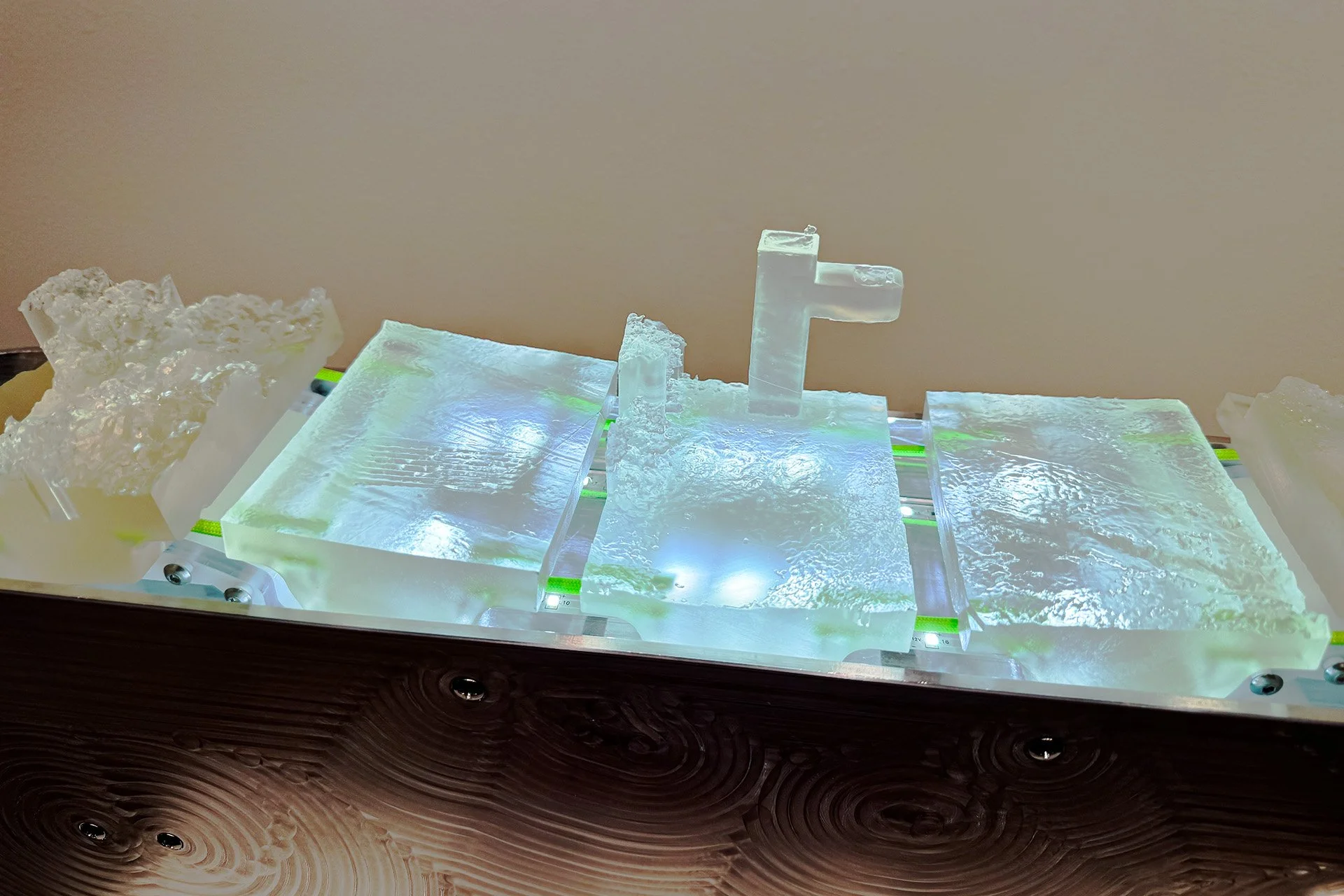  Detail of   TERRA FIRMA STROLL    Terra Firma, meaning dry land : solid ground – the earth’s surface. Encased in machined aluminum plates, fragments of 3D scans from walks are sequenced with a slowly rotating motor to give the viewer a zoomed in exp