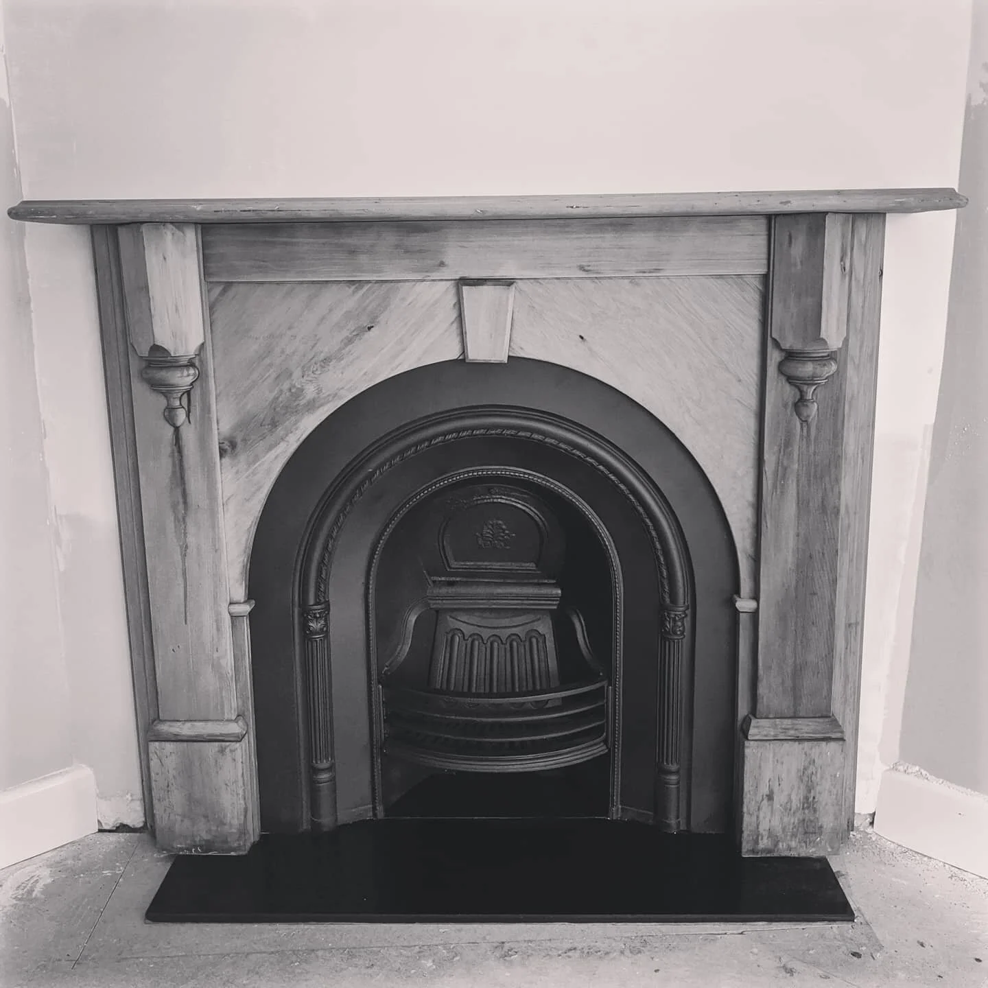 An original Victorian hardwood mantel, cast iron insert &amp; honed granite hearth. #fireplacesurround #fireplace #fireplacedecor #fireplacemakeover #renovation #melbournerenovations #melbournefireplaces #antique