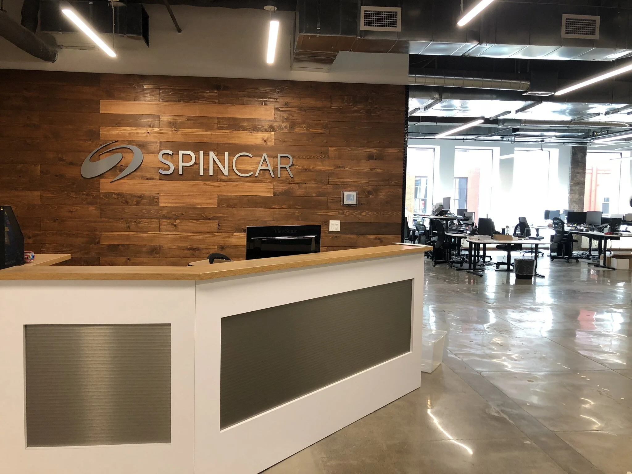 SpinCar expands headquarters at Icon Tower