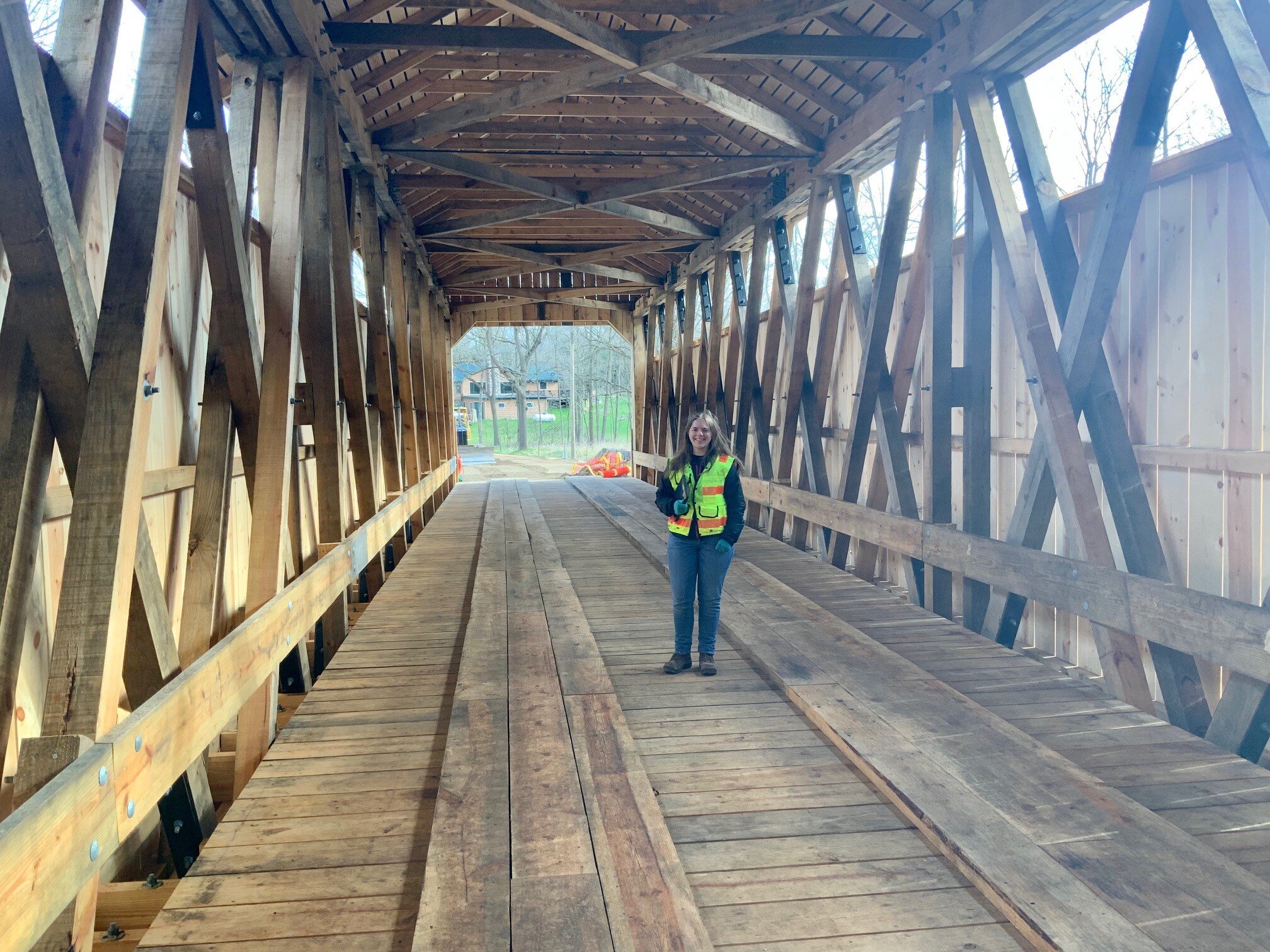 Kayla Bigelow, Design Engineer, conducting a bridge inspection in Ionia County at White’s Bridge. 