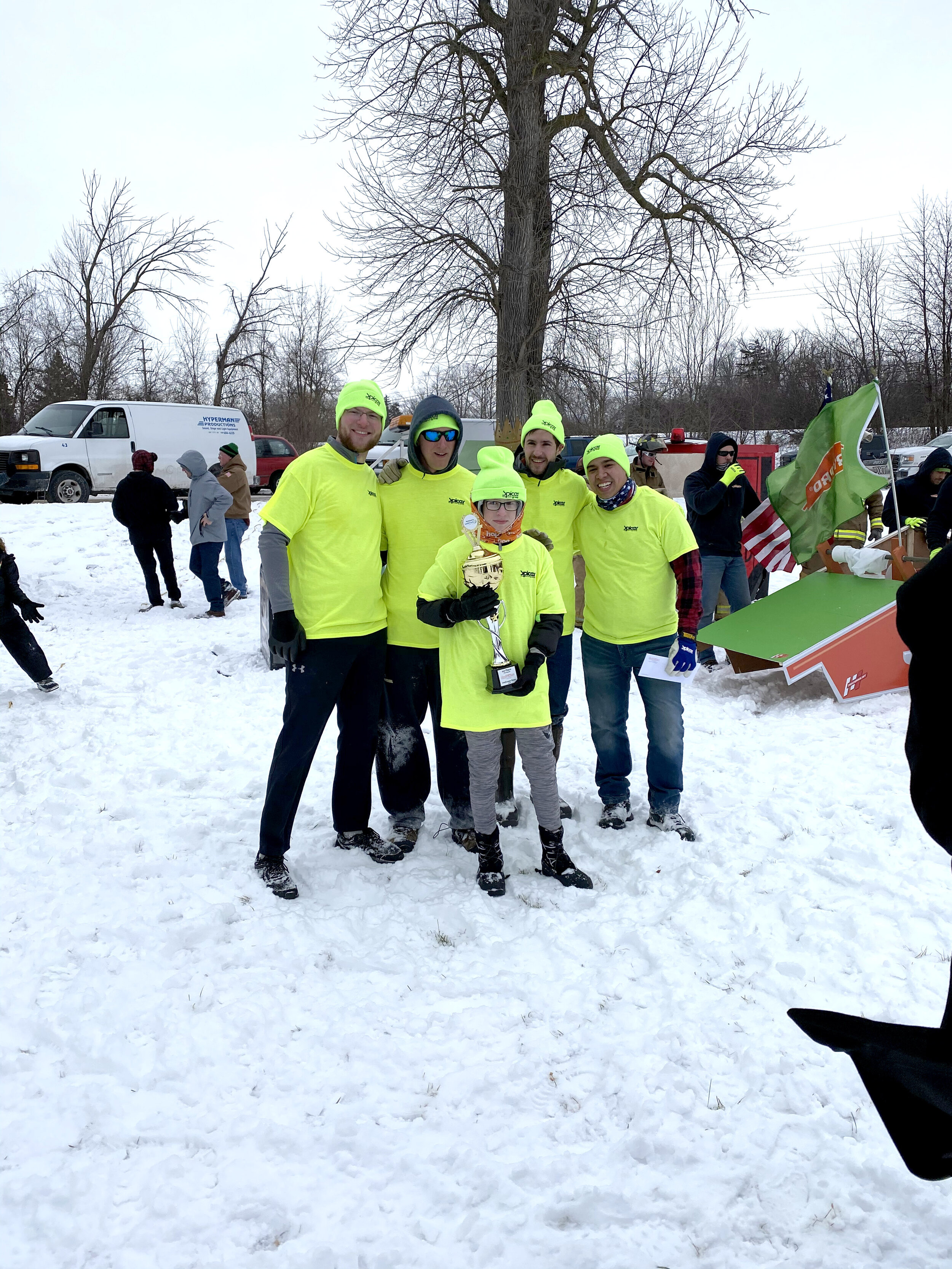  Spicer Group staff members after winning the Saginaw Outhouse Race at Hoyt Park. 