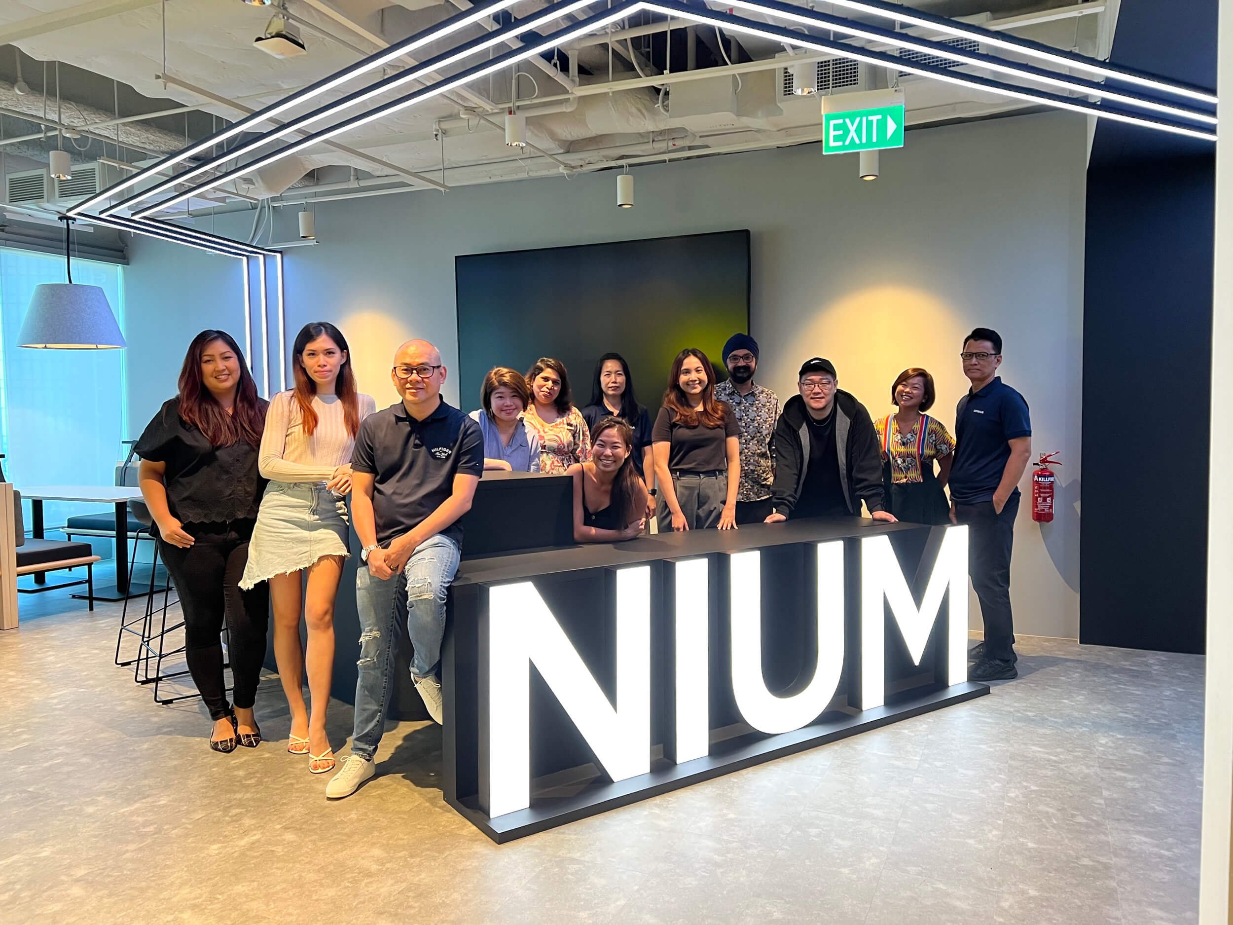  The Nium and Conexus Studio teams commemorating the project’s completion with a group photo  