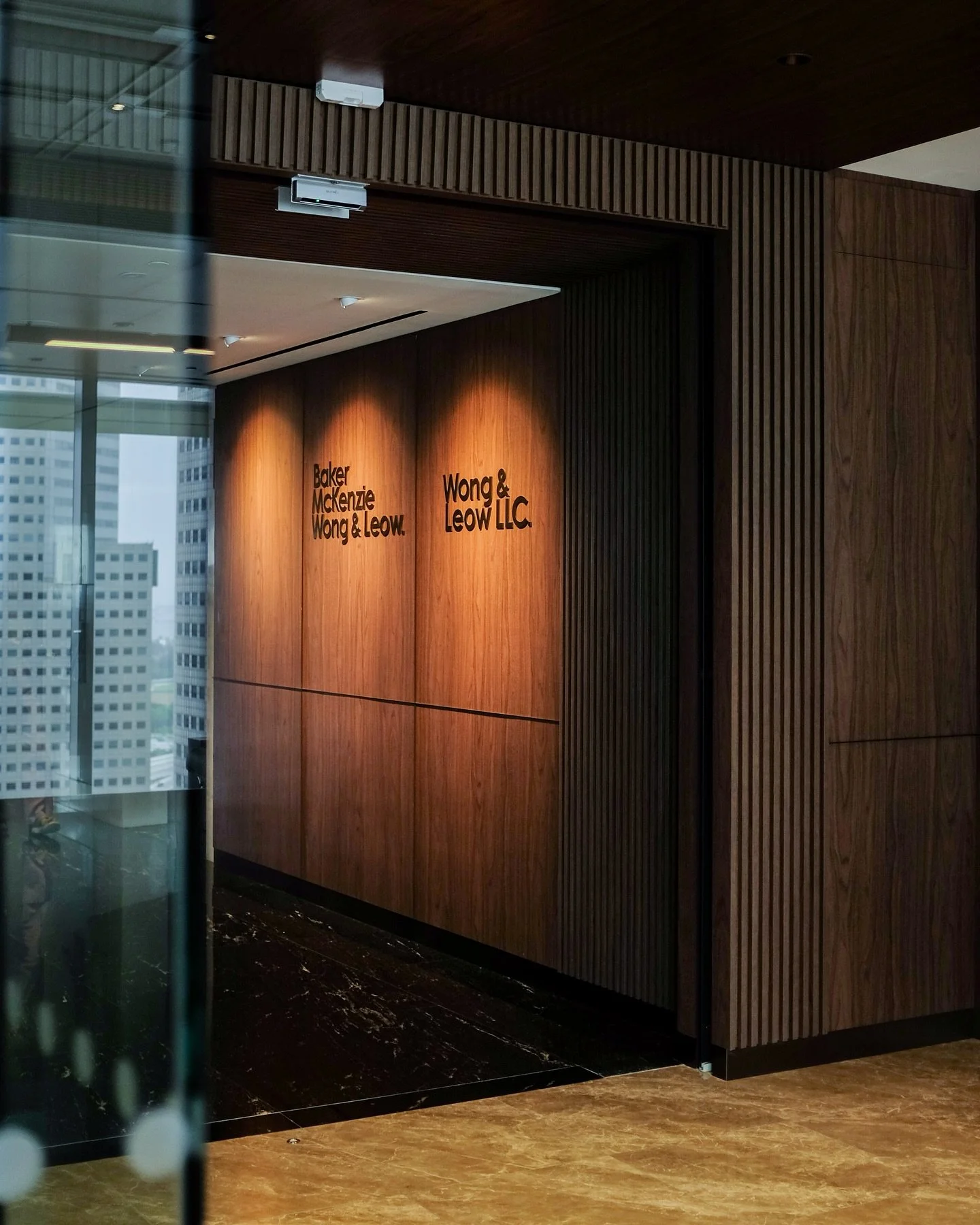Step into Baker McKenzie Wong &amp; Leow&lsquo;s new office&mdash;a space where legacy and refinement are woven into every detail. ✨

Here, the quiet strength of natural marble meets the timeless warmth of dark wood, forming a canvas of
sophisticatio