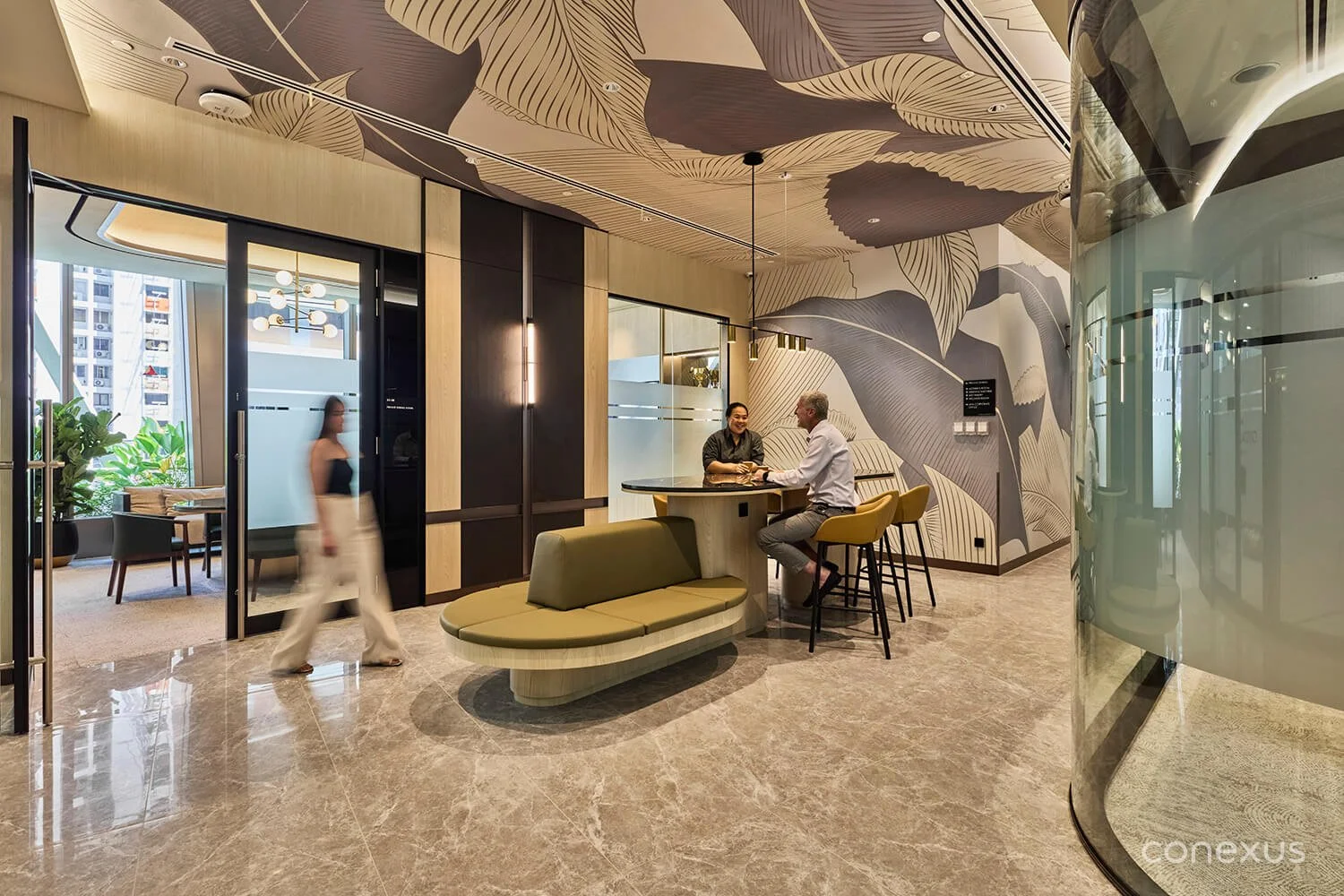  Plush textures and marble accents create a sophisticated setting for workplace collaboration and dialogue. 