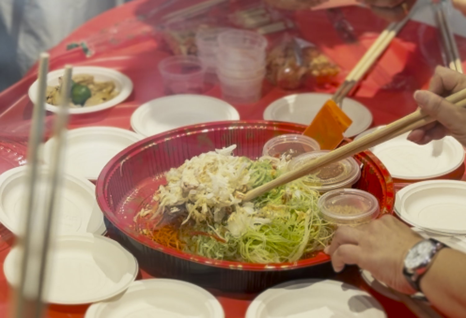  All set for the festive toss, with ingredients arranged for a boisterous lohei filled with joyous blessings. 