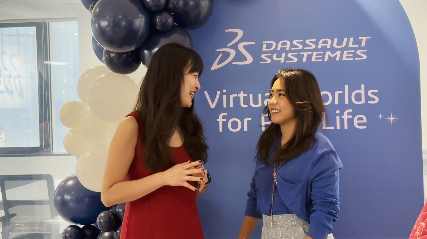  Sharing a laugh and catching up — a cheerful scene from the celebration. 