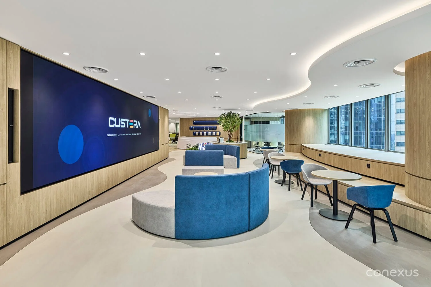  Soft, layered lighting, plush fabric furniture, and architectural curves create a warm, lively environment that elevates the everyday. 