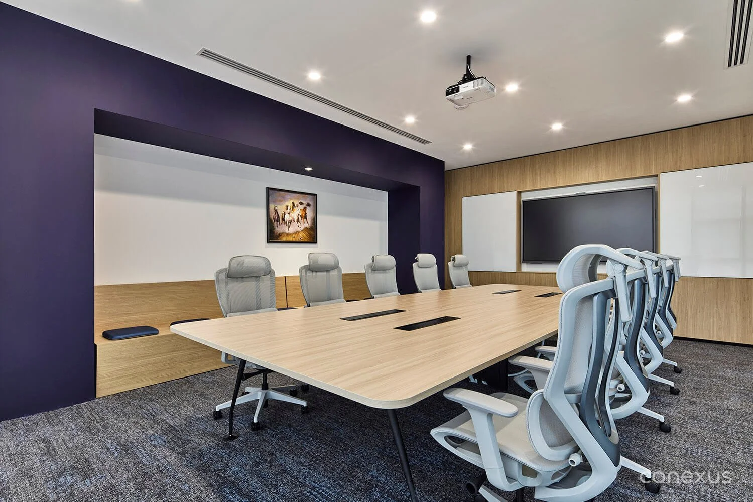  The boardroom pairs a refined, professional setting with the warm, natural material palette carried throughout the workplace. 